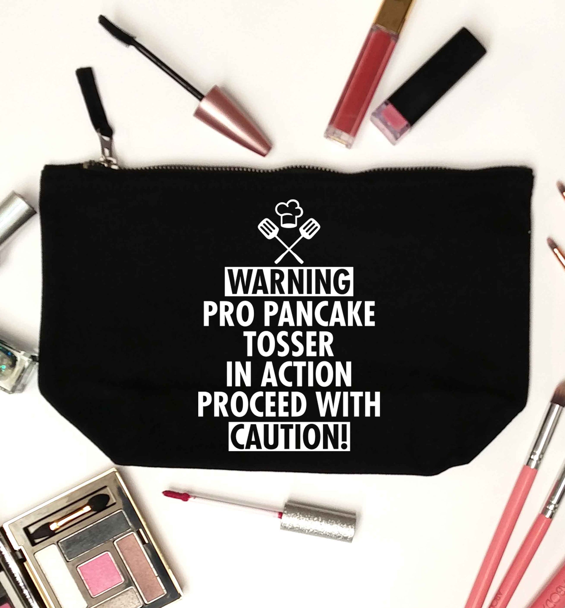 Warning pro pancake tosser in action proceed with caution black makeup bag