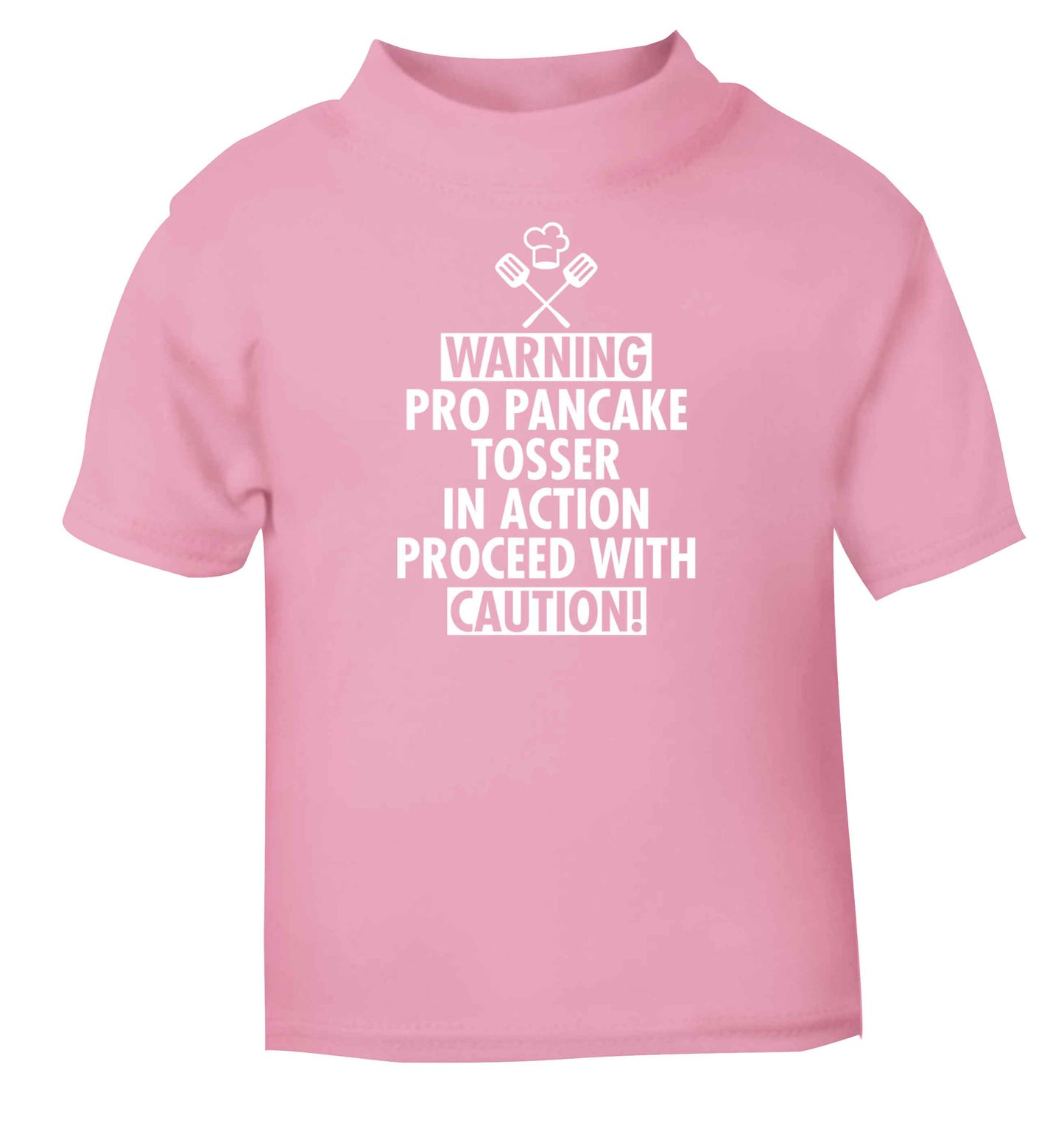 Warning pro pancake tosser in action proceed with caution light pink baby toddler Tshirt 2 Years