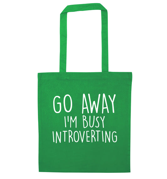 Go away I'm busy introverting green tote bag