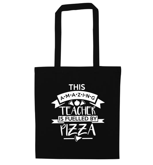 This amazing teacher is fuelled by pizza black tote bag