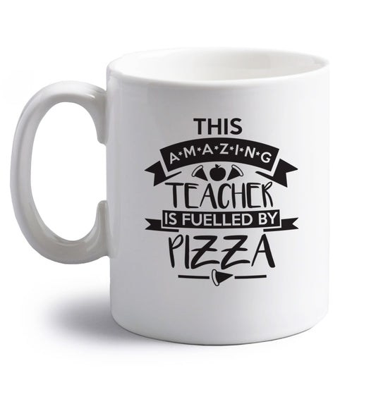 This amazing teacher is fuelled by pizza right handed white ceramic mug 