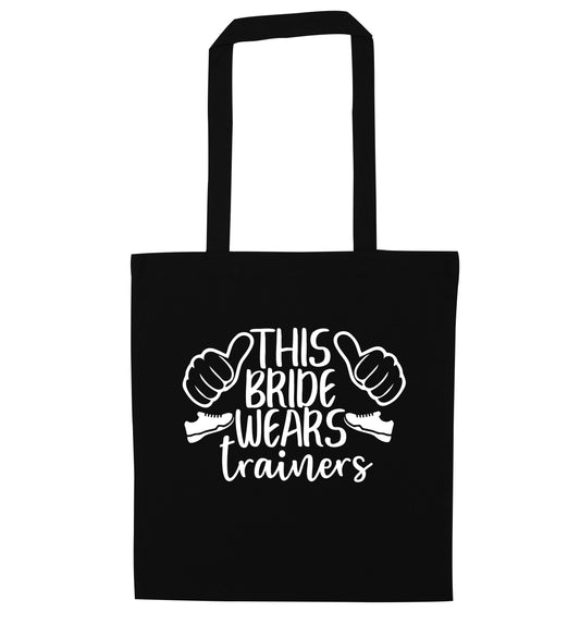 This bride wears trainers black tote bag