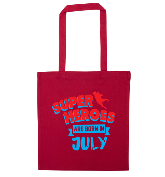 Superheroes are born in July red tote bag