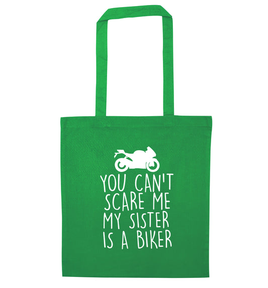 You can't scare me my sister is a biker green tote bag