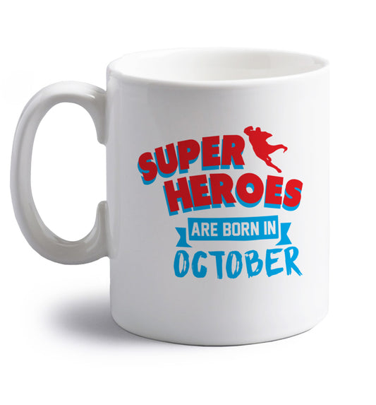 Superheroes are born in October right handed white ceramic mug 