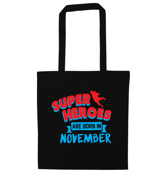 Superheroes are born in November black tote bag
