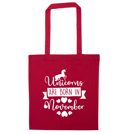 Unicorns are born in November red tote bag