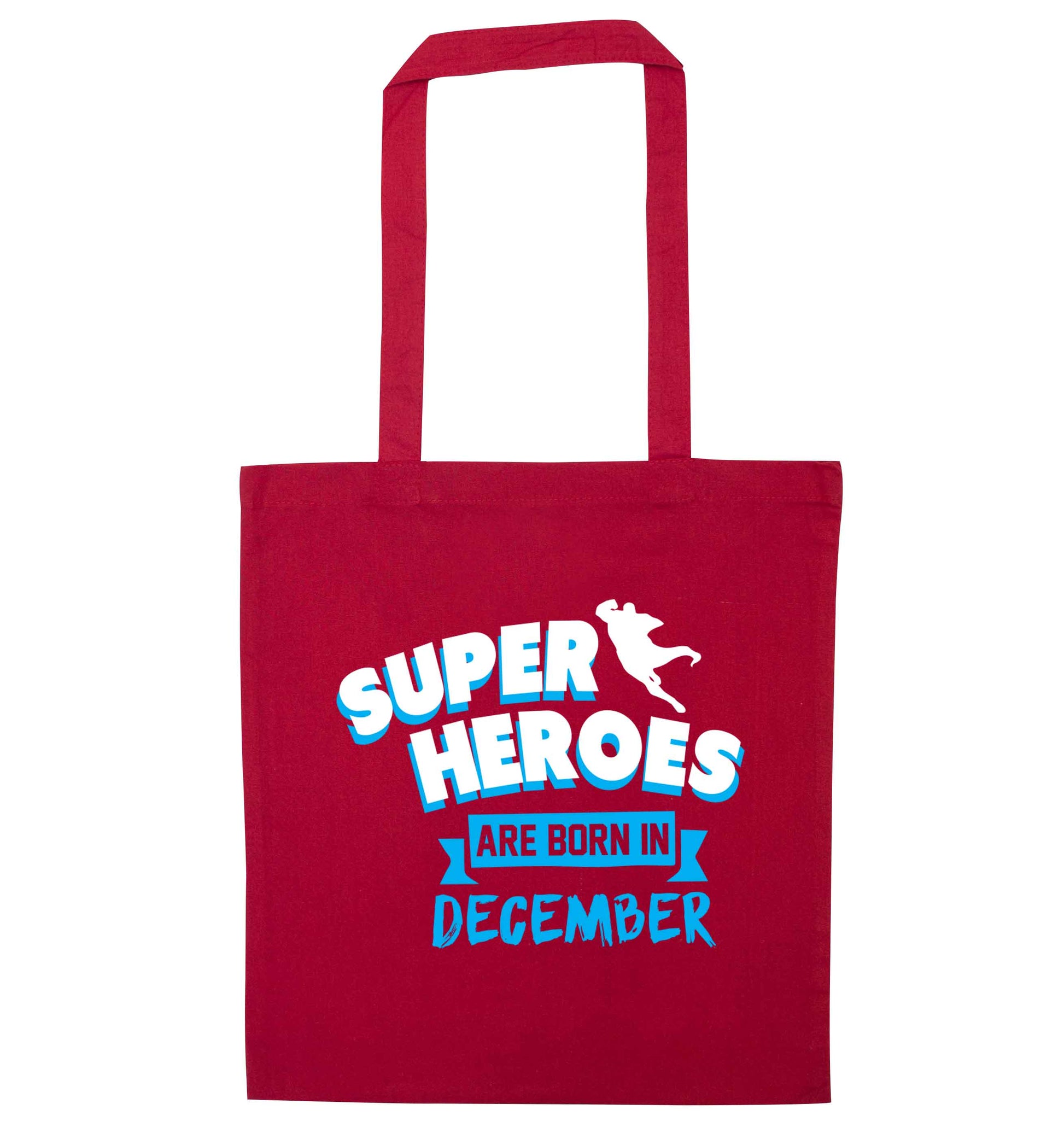 Superheroes are born in December red tote bag