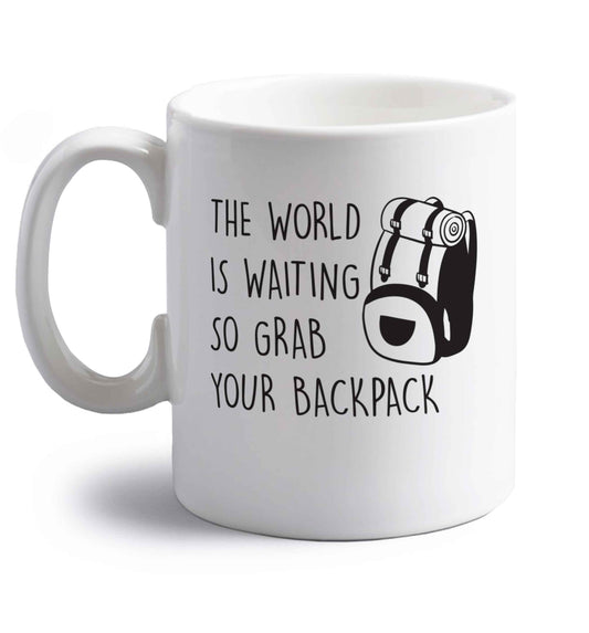 The world is waiting so grab your backpack right handed white ceramic mug 