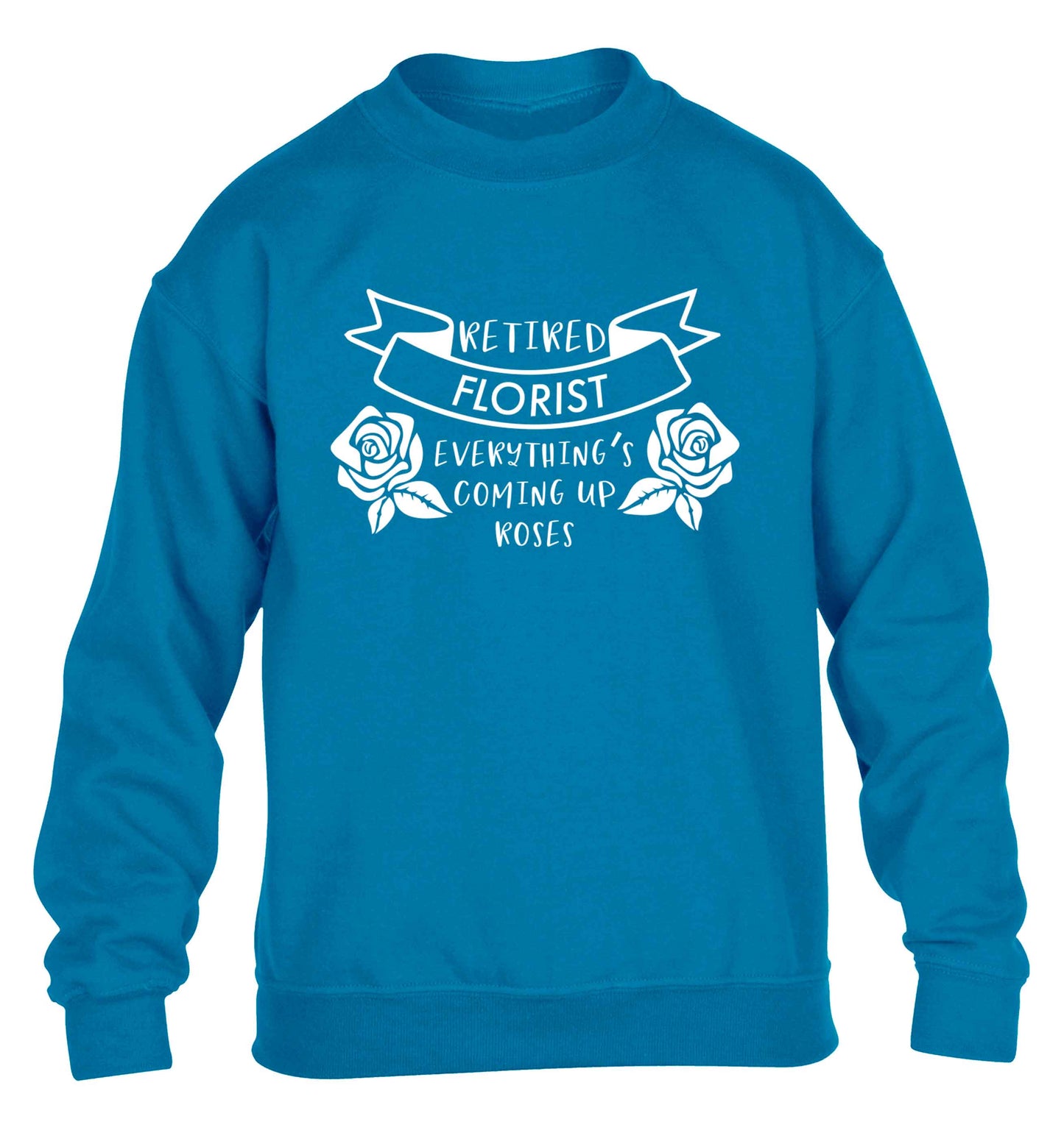 Retired florist everything's coming up roses children's blue sweater 12-13 Years