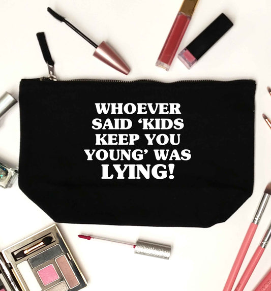 Whoever said 'kids keep you young' was lying! black makeup bag