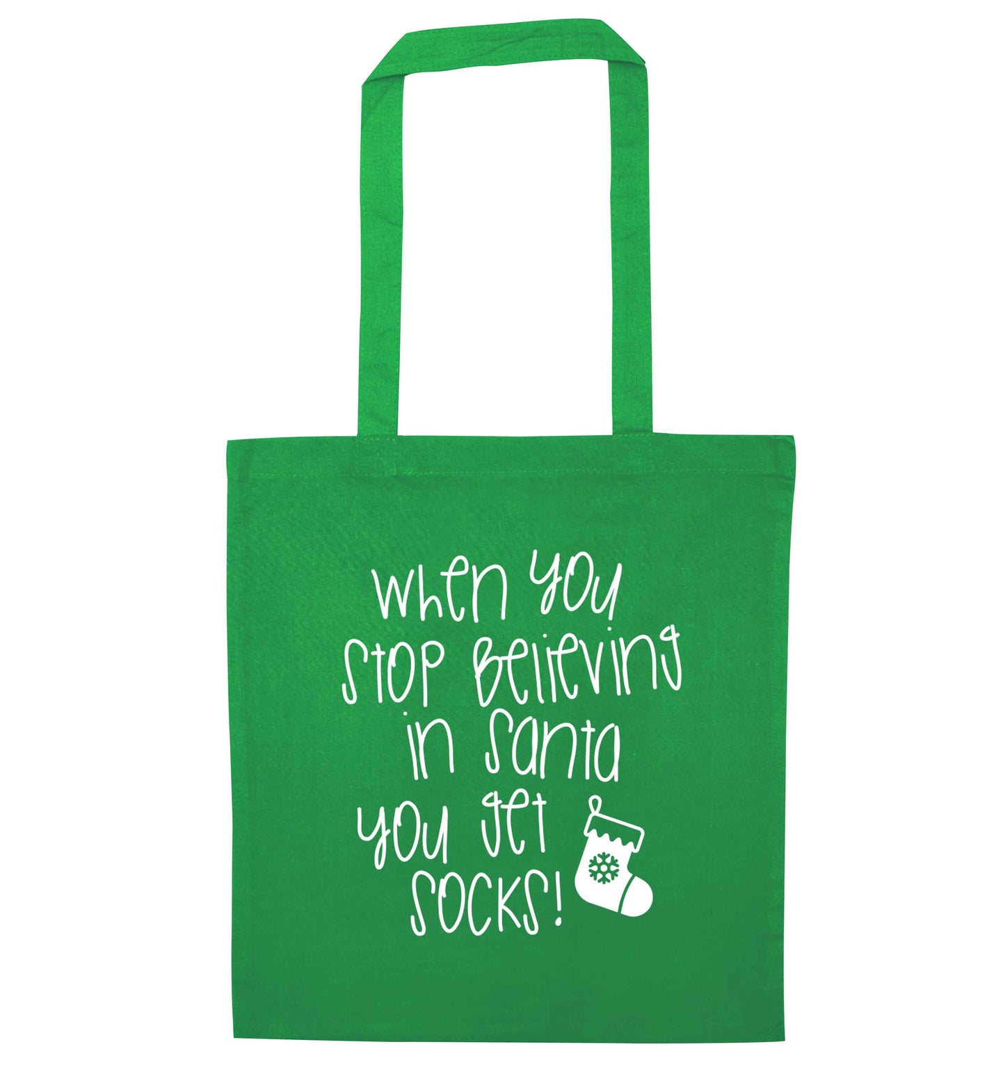 When you stop believing in santa you get socks green tote bag