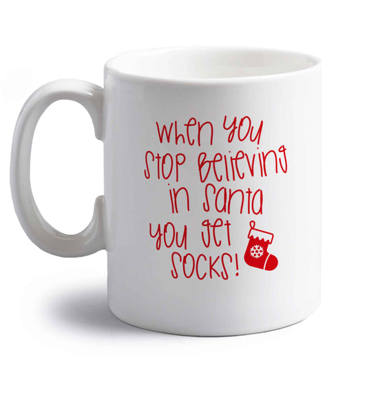 When you stop believing in santa you get socks right handed white ceramic mug 