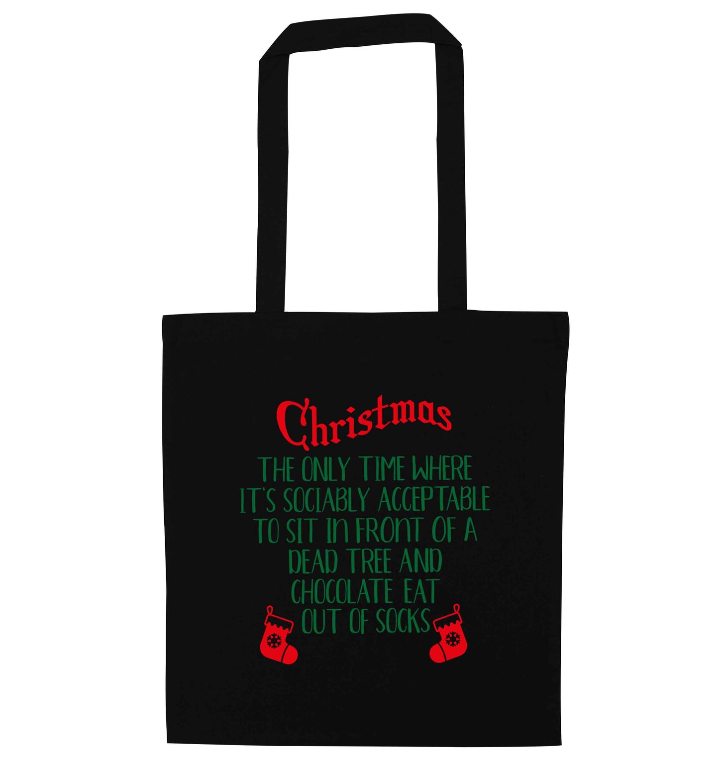 Christmas sit in front of a dead tree and eat chocolate out of socks black tote bag