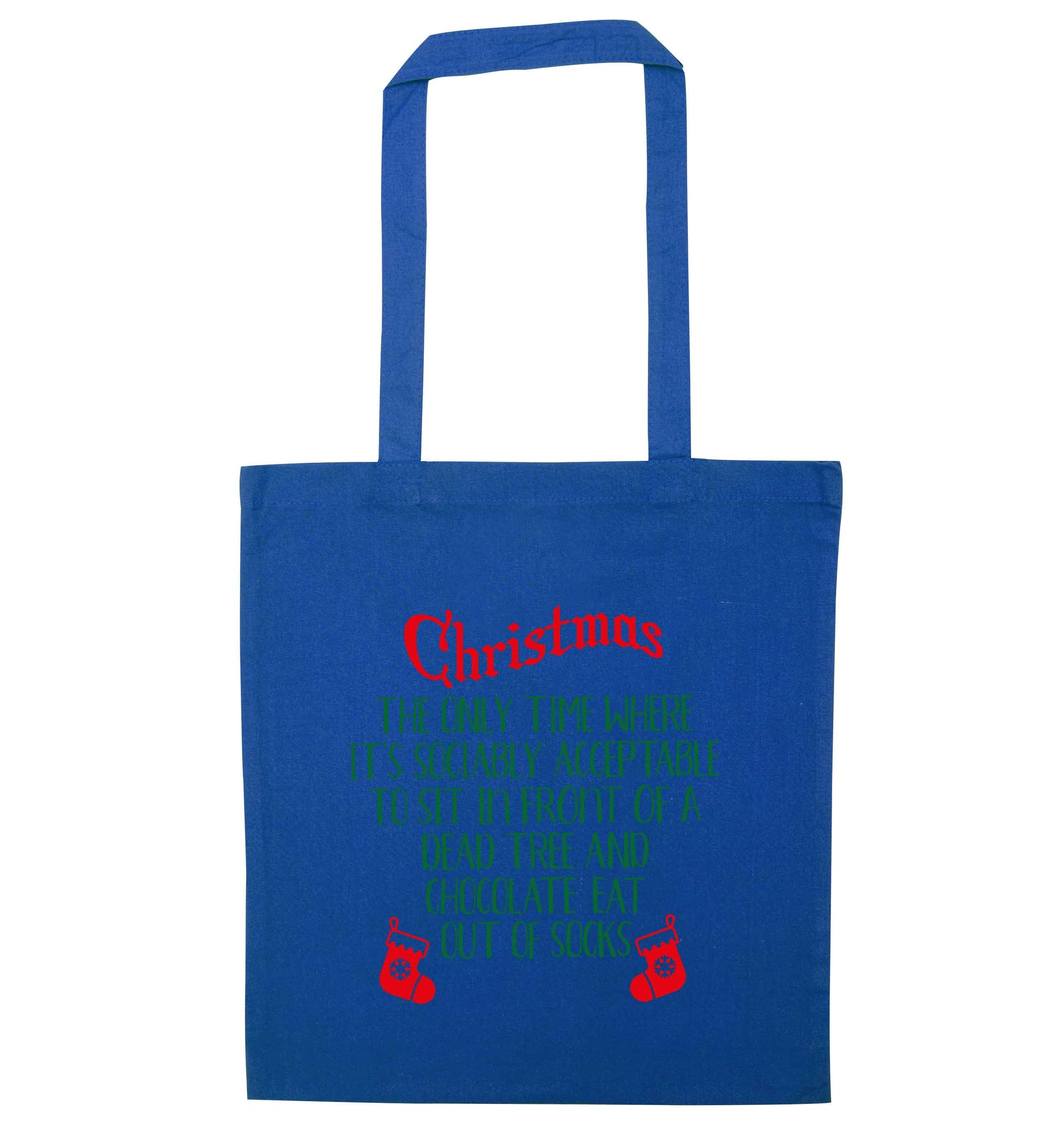Christmas sit in front of a dead tree and eat chocolate out of socks blue tote bag
