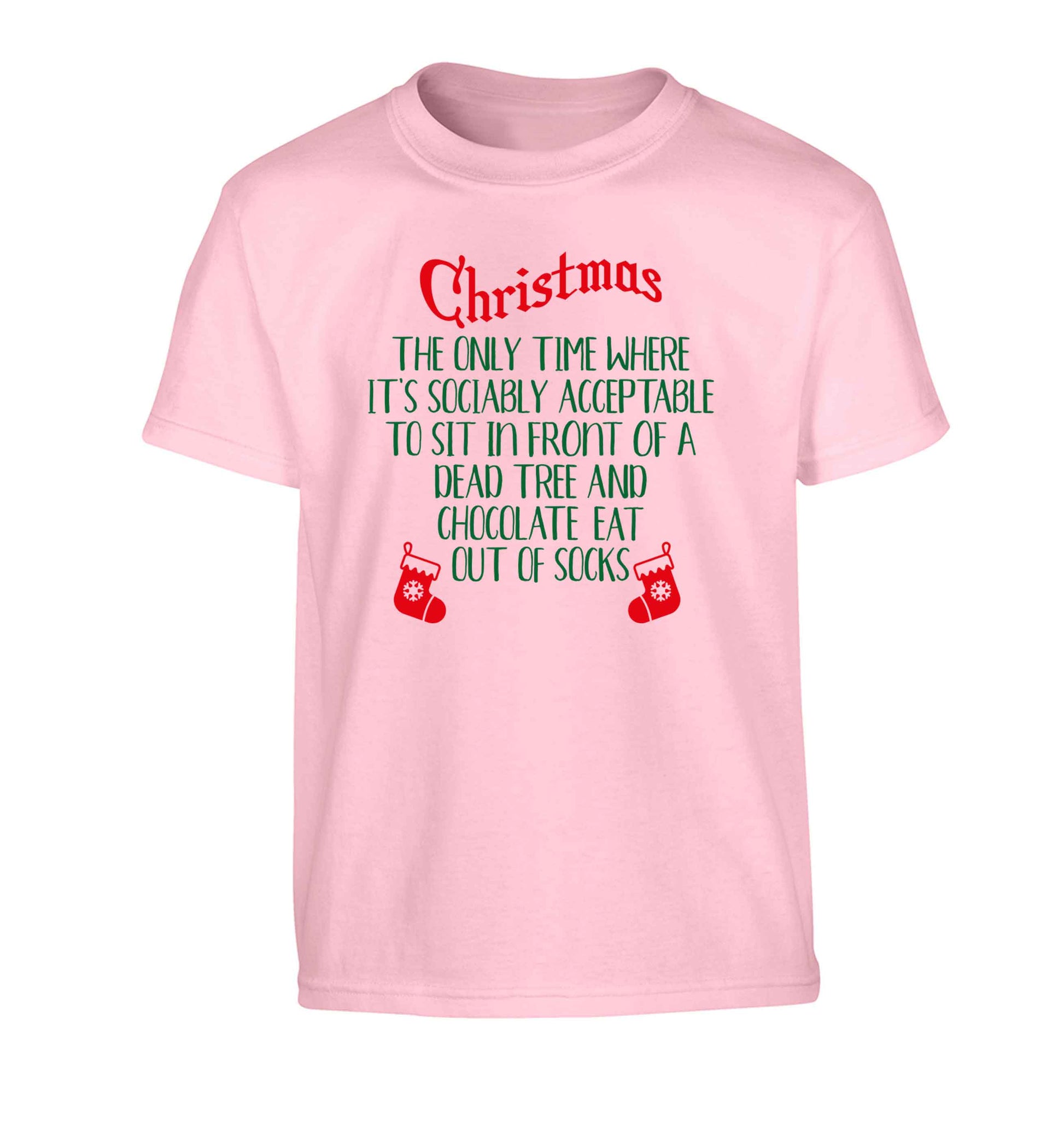 Christmas sit in front of a dead tree and eat chocolate out of socks Children's light pink Tshirt 12-13 Years