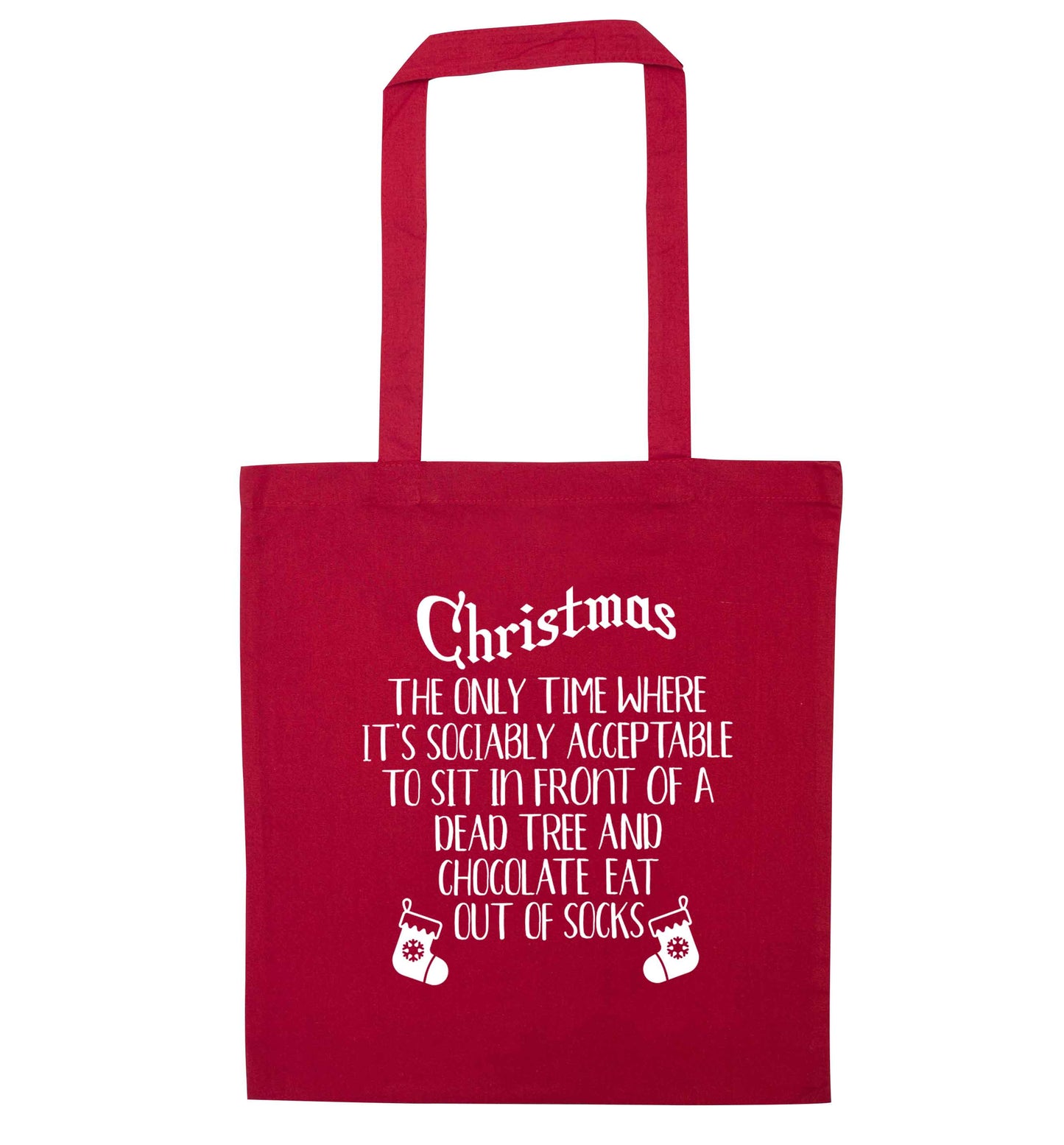 Christmas sit in front of a dead tree and eat chocolate out of socks red tote bag