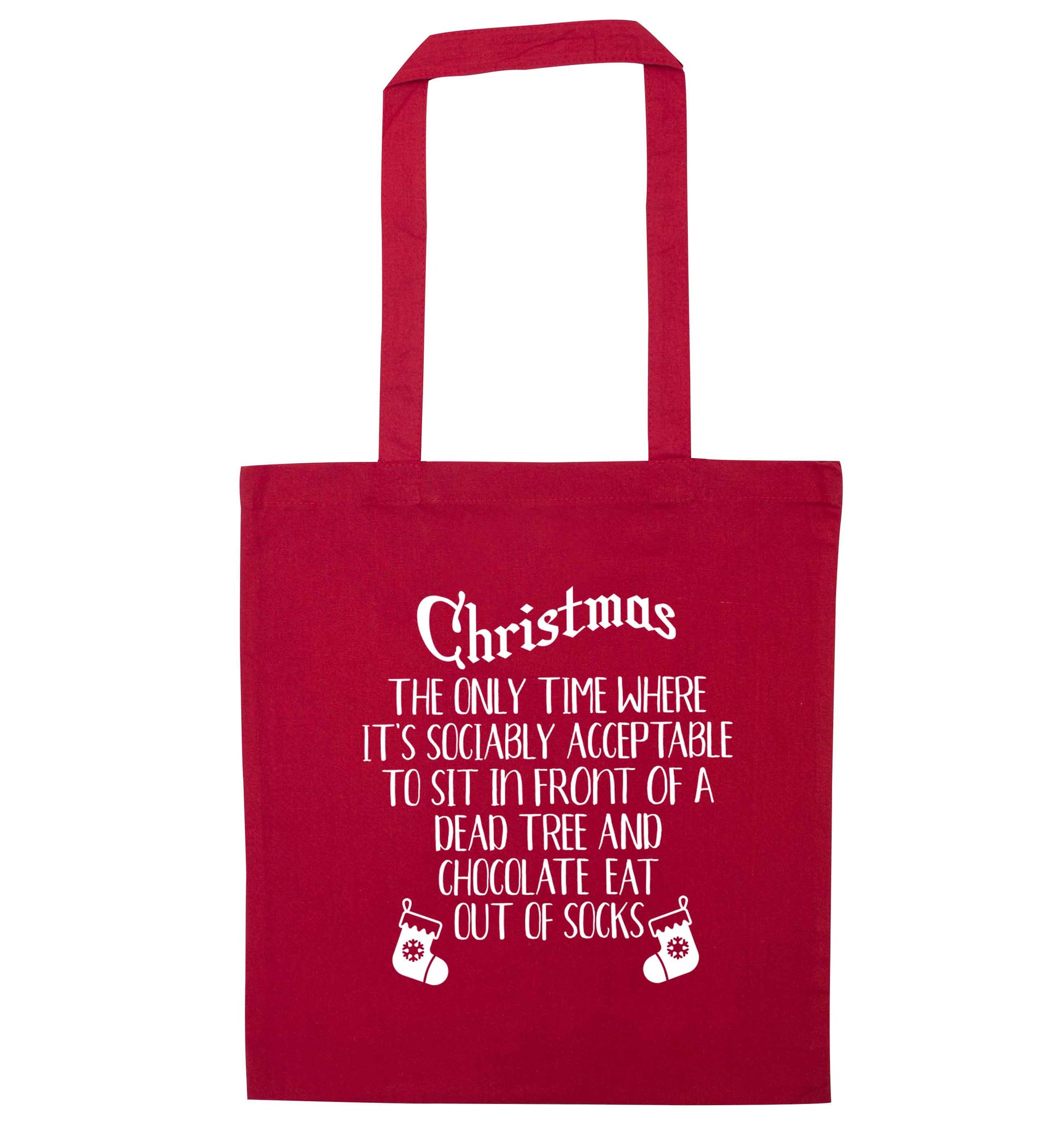 Christmas sit in front of a dead tree and eat chocolate out of socks red tote bag