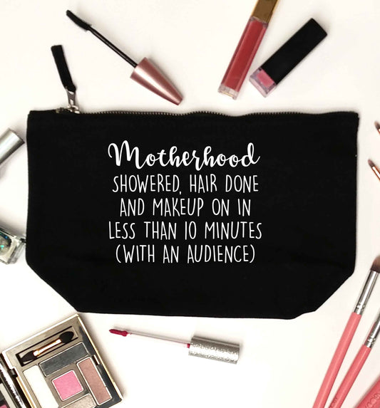 Motherhood, showered, hair done and makeup on black makeup bag