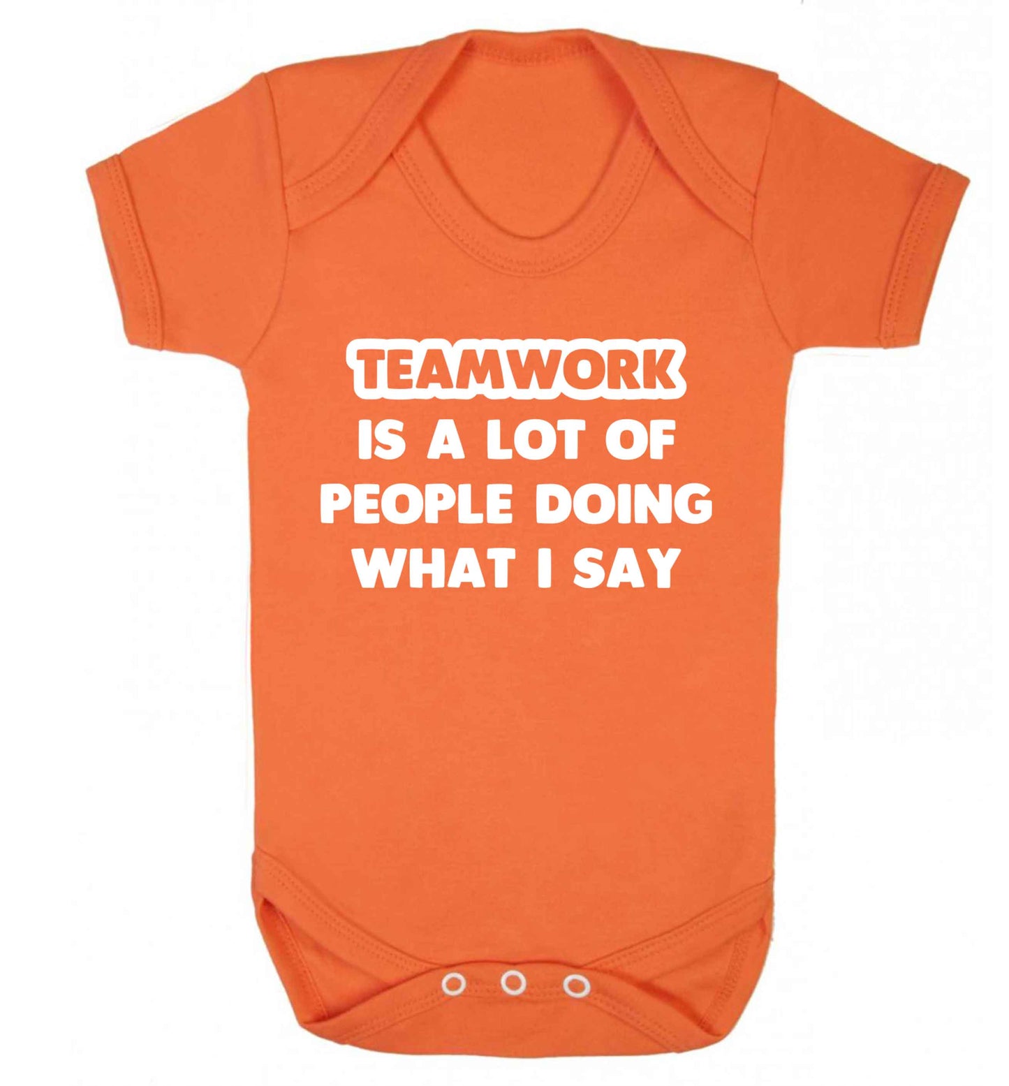 Teamwork is a lot of people doing what I say Baby Vest orange 18-24 months