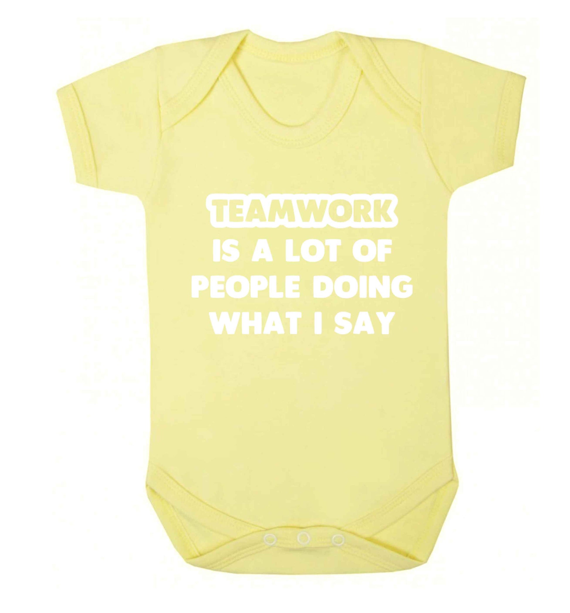 Teamwork is a lot of people doing what I say Baby Vest pale yellow 18-24 months