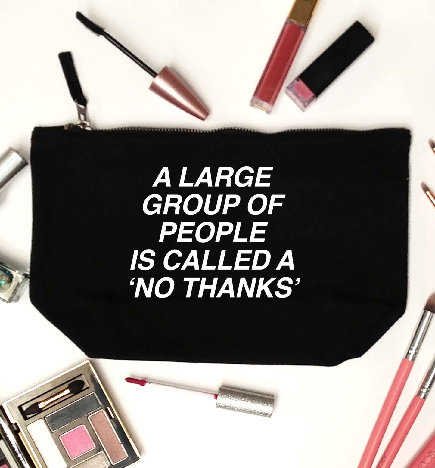 A group of people is called a 'no thanks' black makeup bag