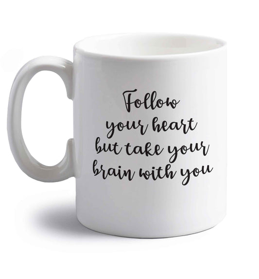 Follow your heart but take your head with you right handed white ceramic mug 