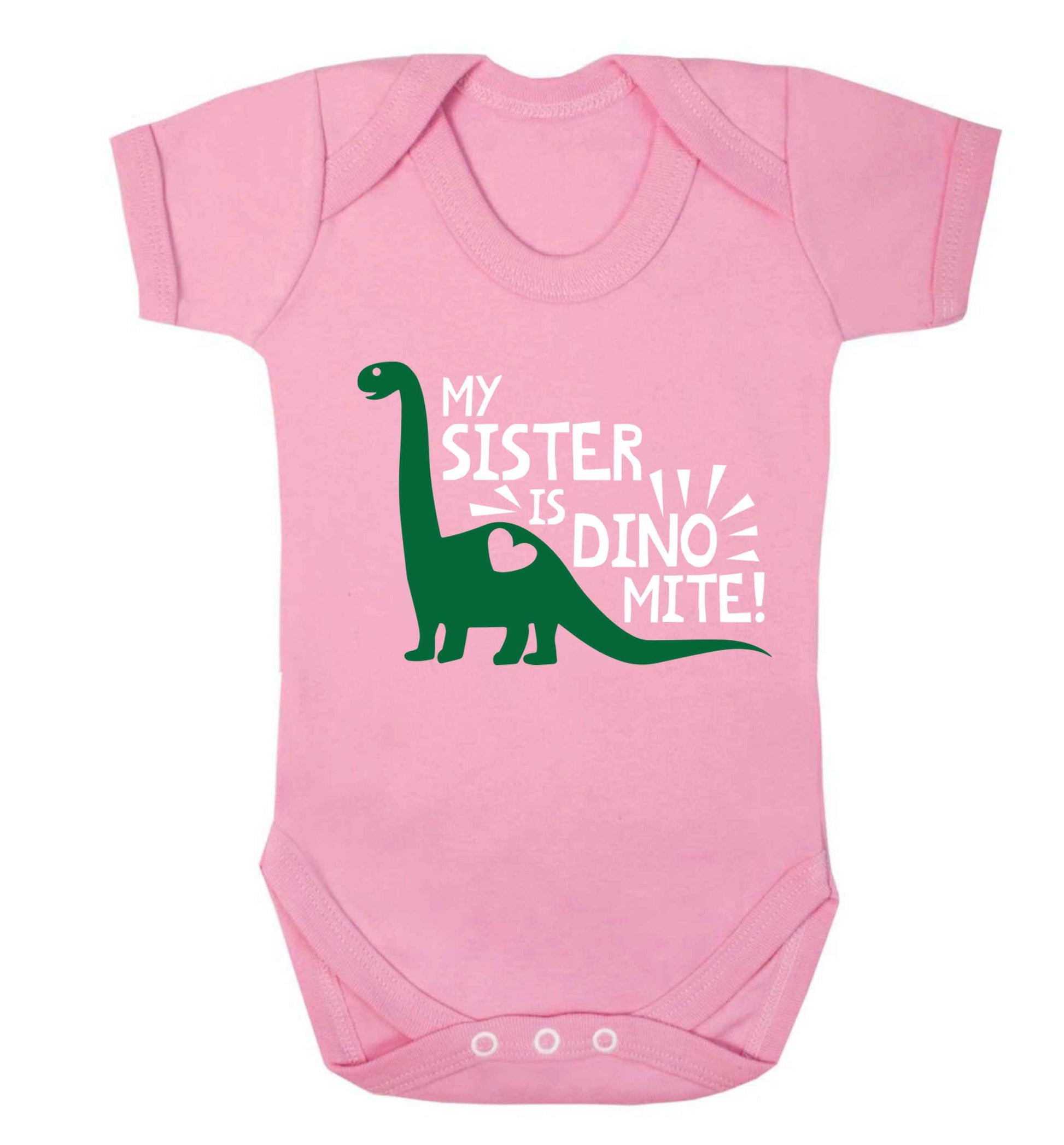 My sister is dinomite! Baby Vest pale pink 18-24 months
