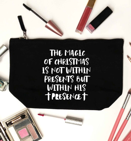 The magic of Christmas is not within presents but within his presence black makeup bag