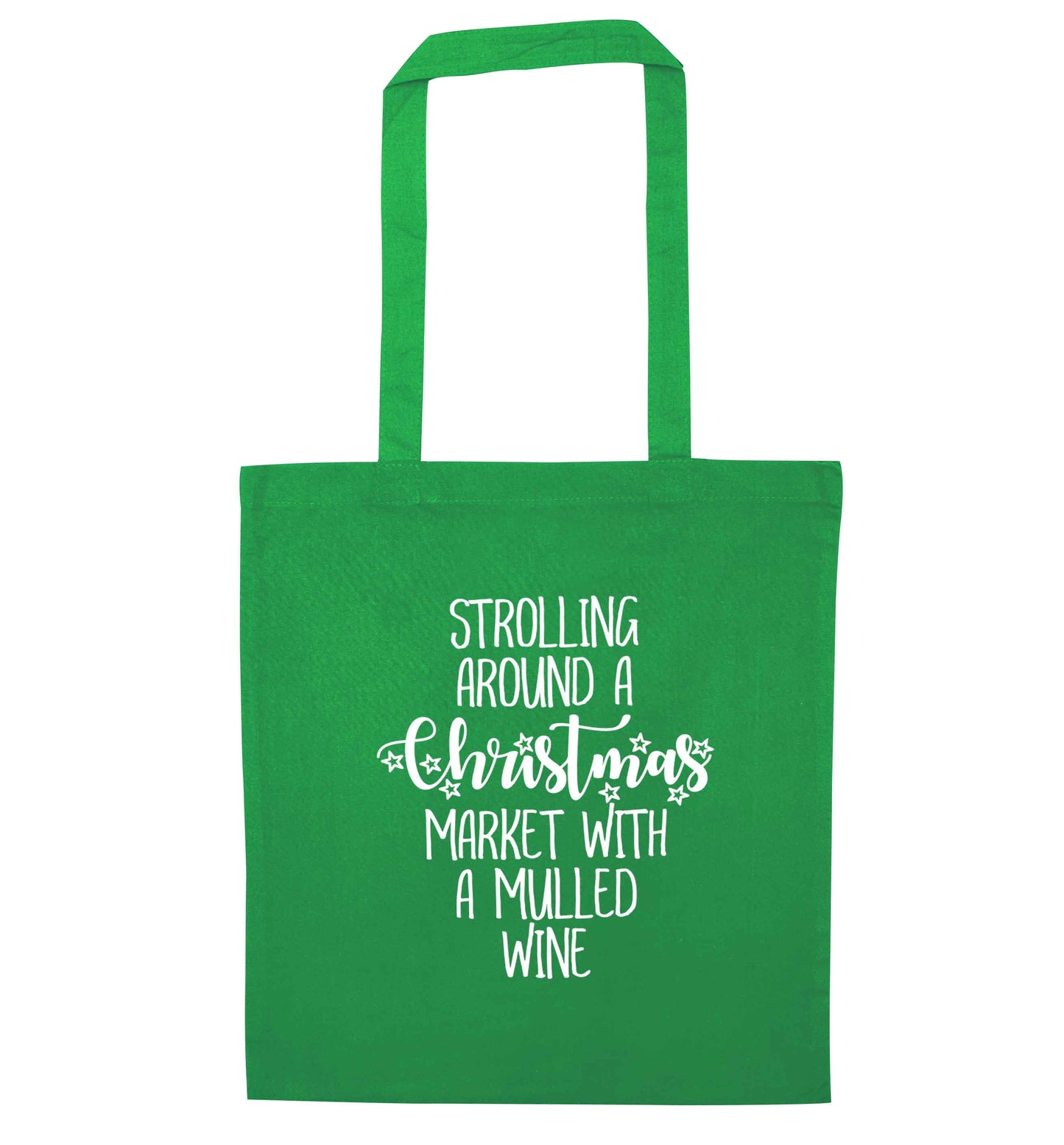 Strolling around a Christmas market with mulled wine green tote bag