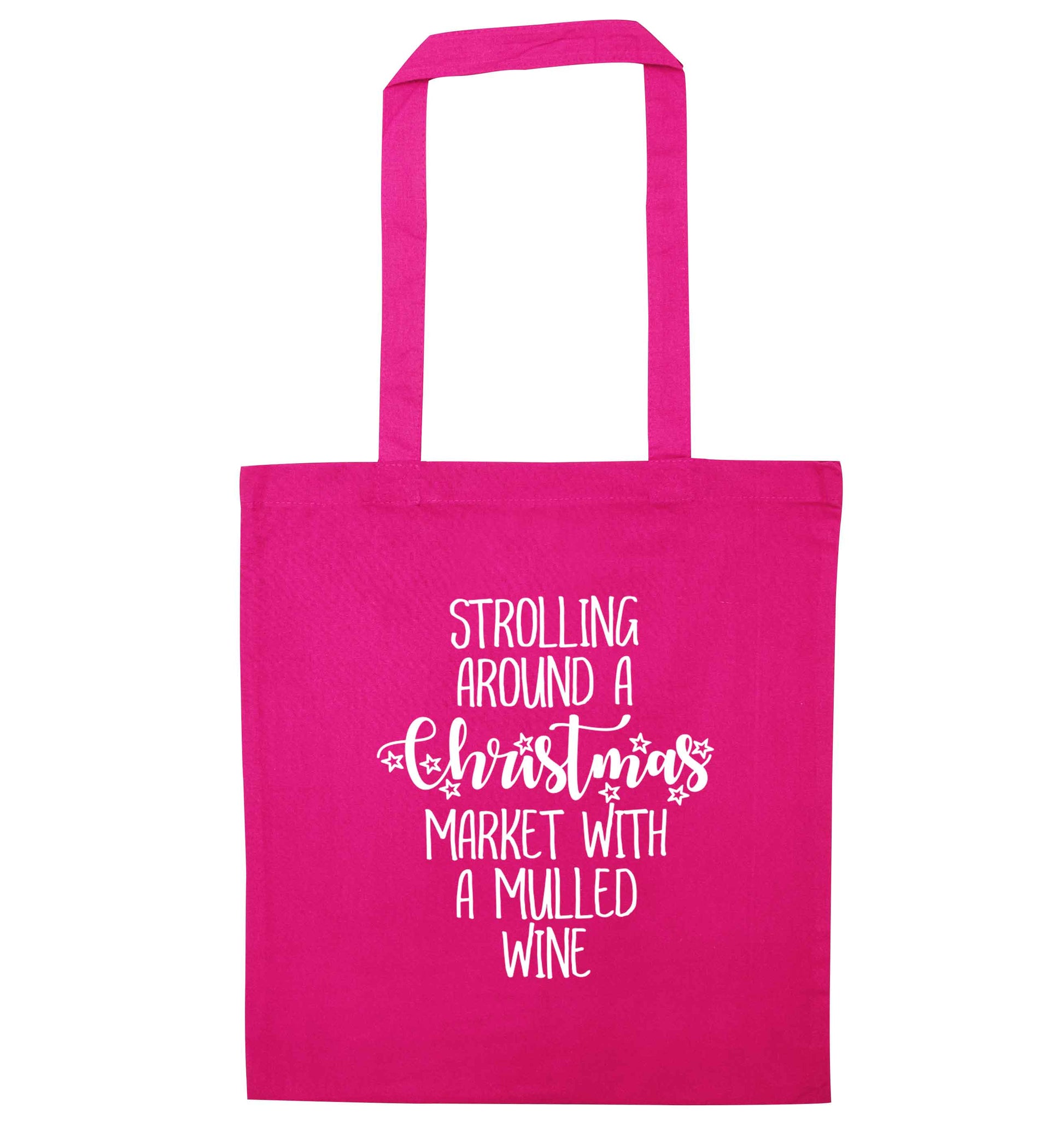 Strolling around a Christmas market with mulled wine pink tote bag