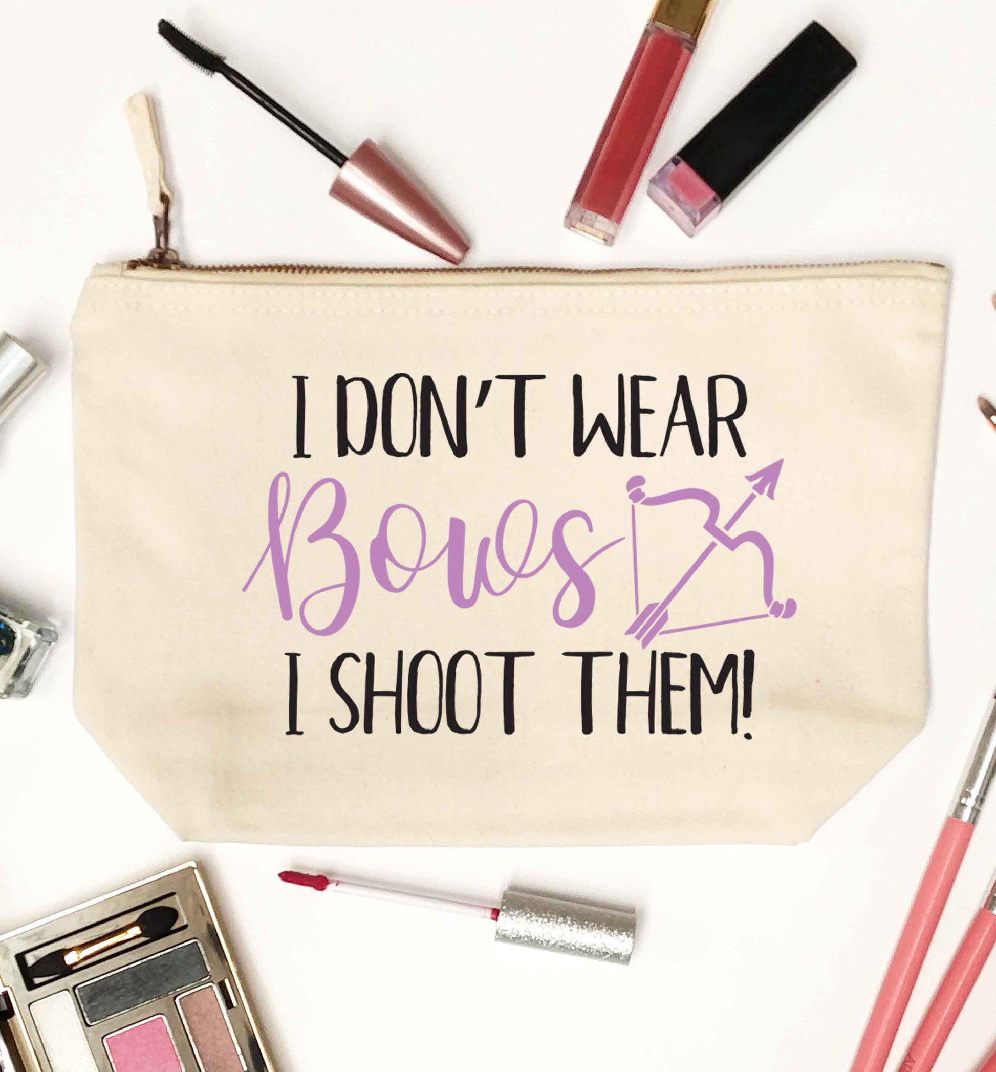 I don't wear bows I shoot them natural makeup bag