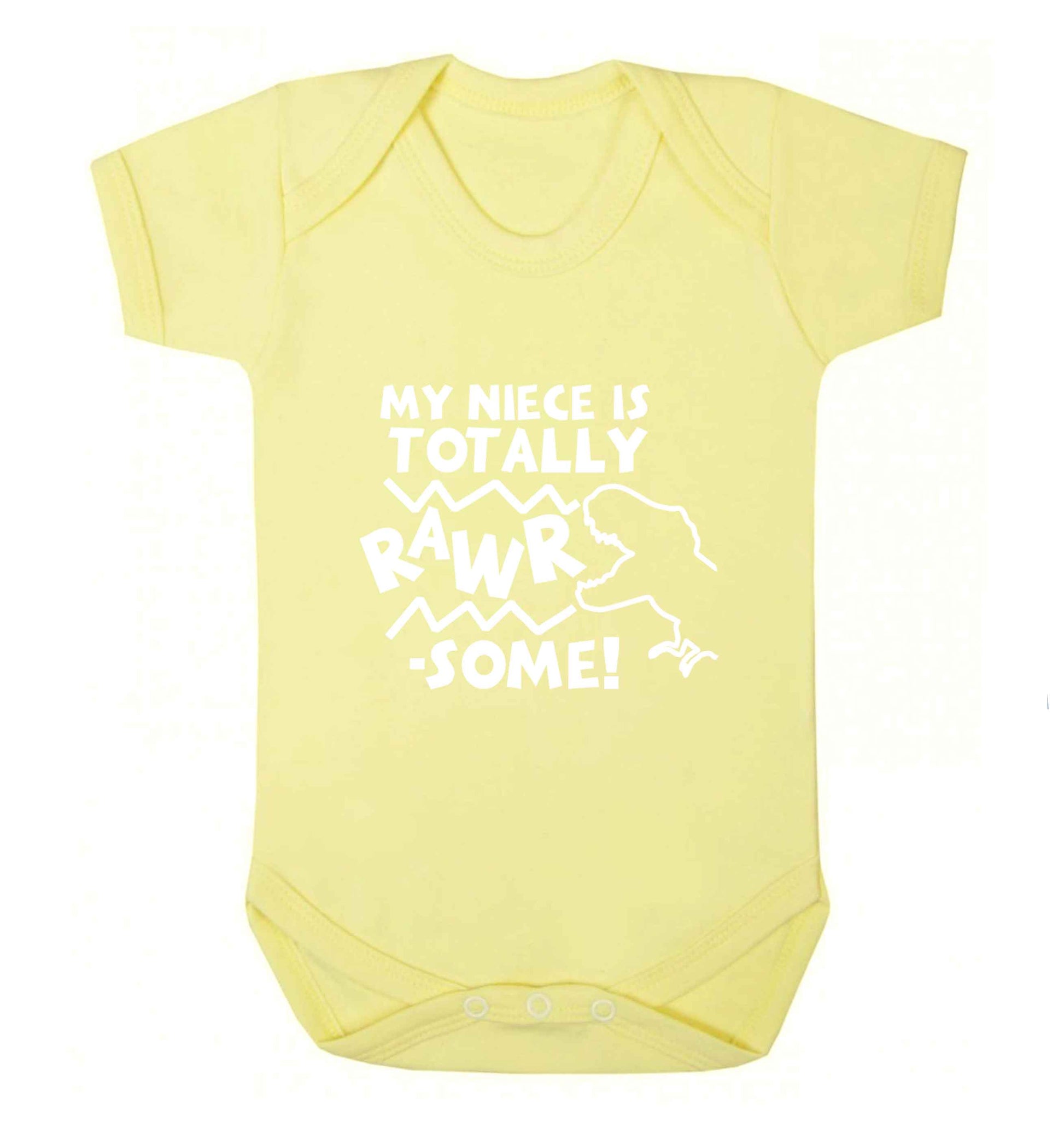 My niece is totally rawrsome baby vest pale yellow 18-24 months