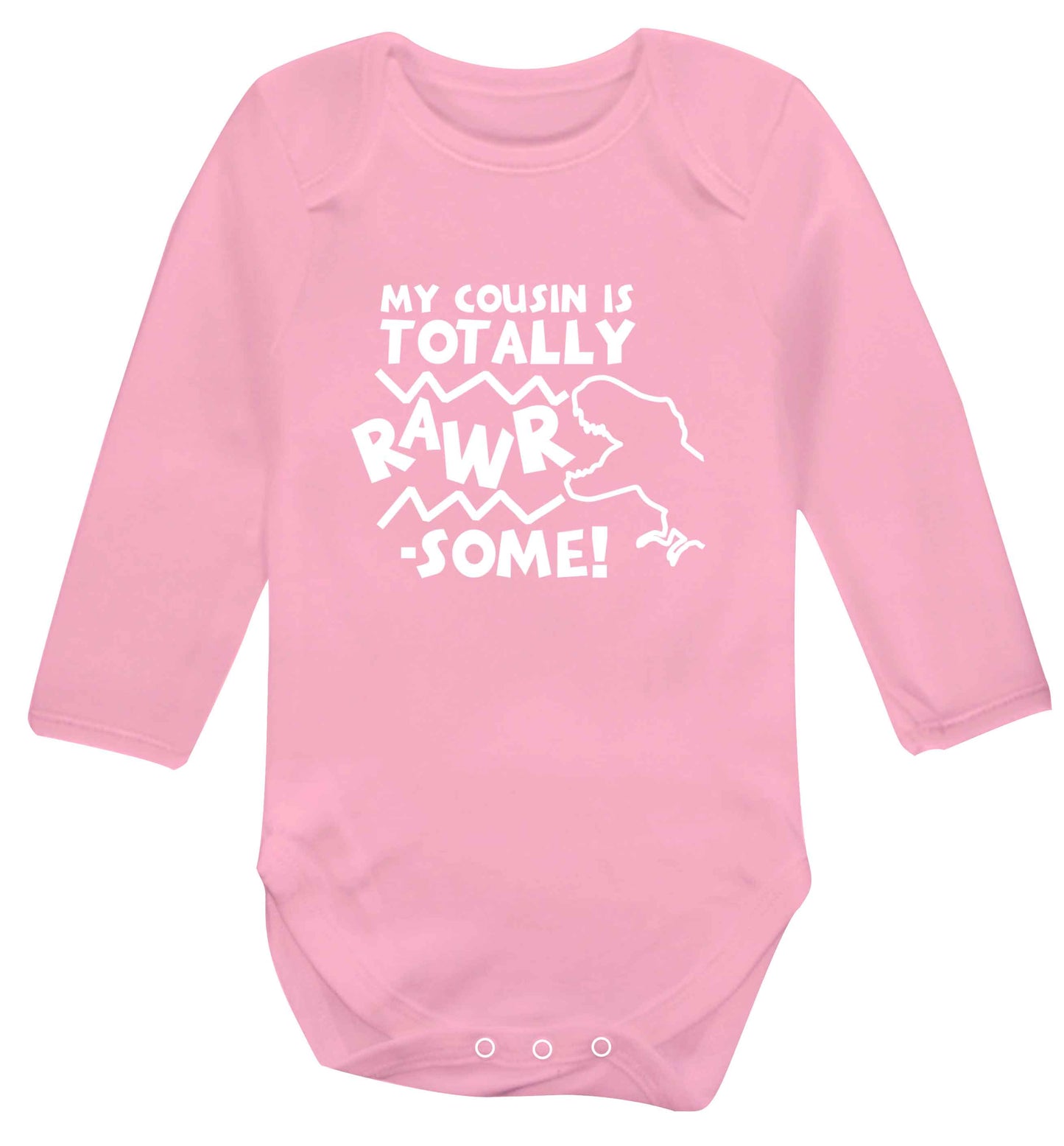 My cousin is totally rawrsome baby vest long sleeved pale pink 6-12 months