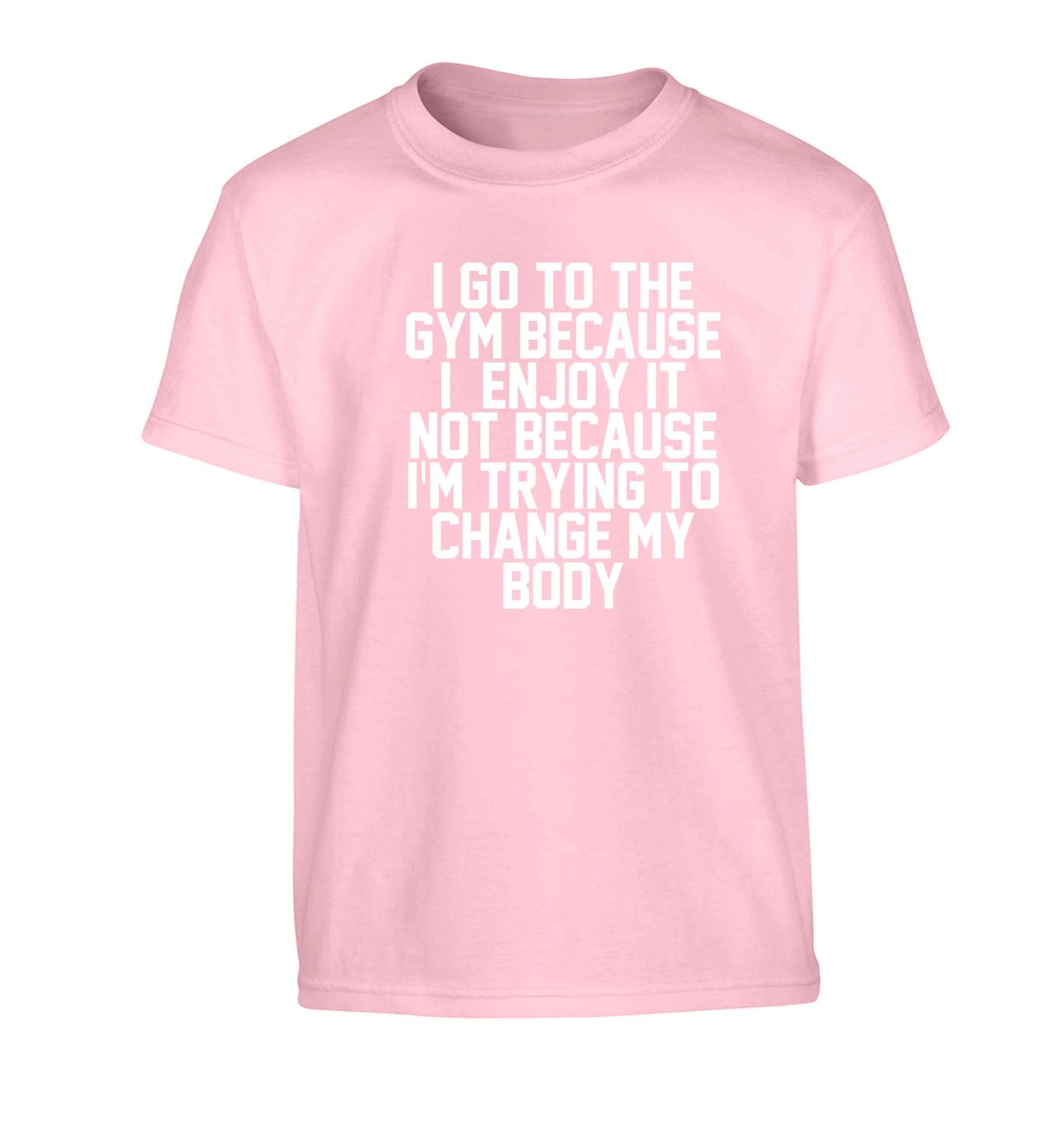 I go to the gym because I enjoy it not because I'm trying to change my body Children's light pink Tshirt 12-13 Years