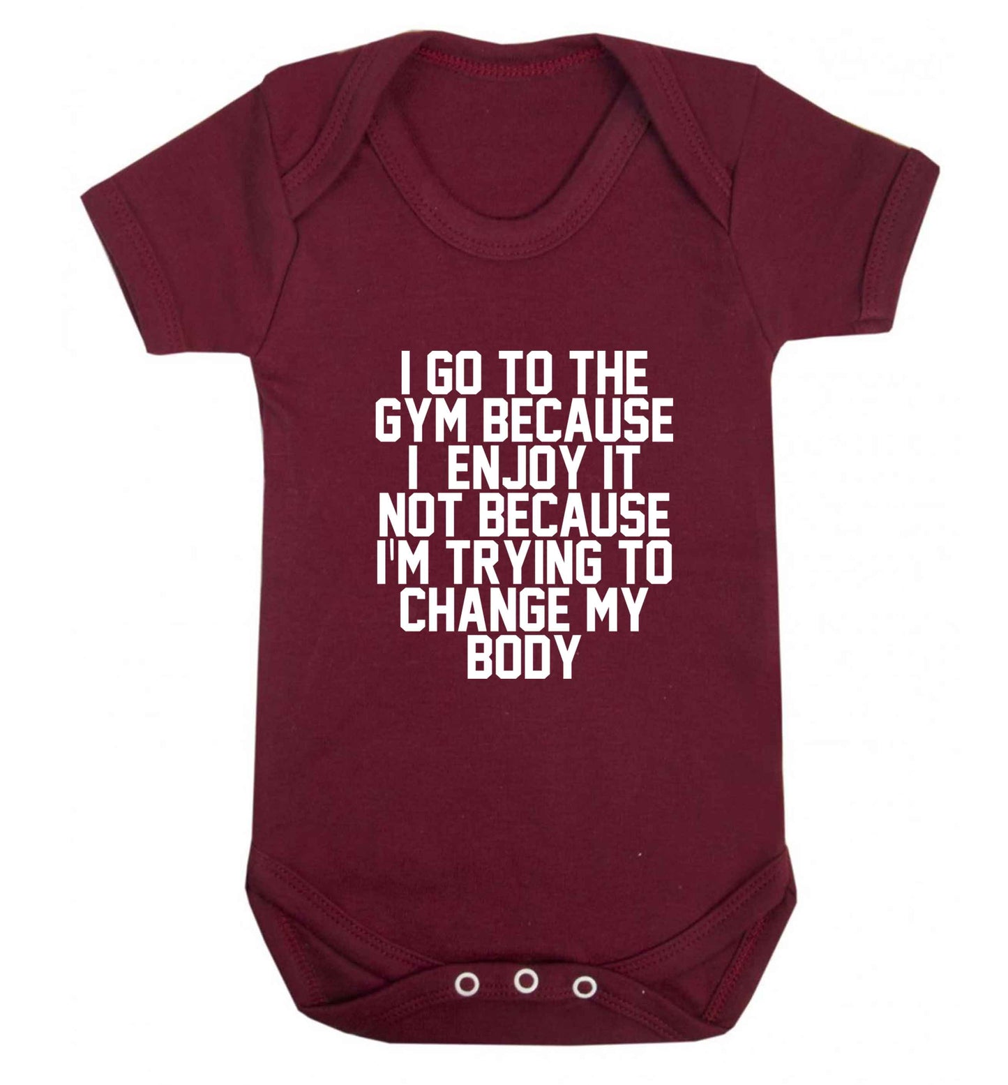 I go to the gym because I enjoy it not because I'm trying to change my body baby vest maroon 18-24 months
