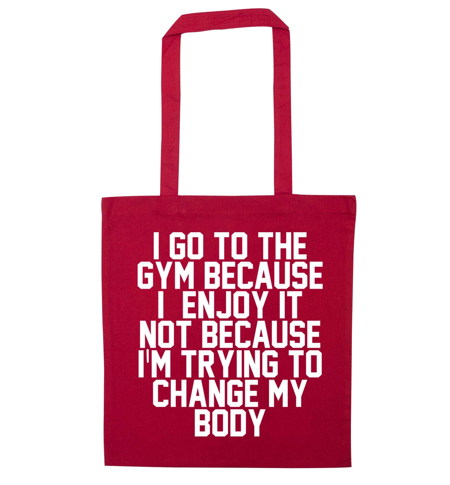 I go to the gym because I enjoy it not because I'm trying to change my body red tote bag