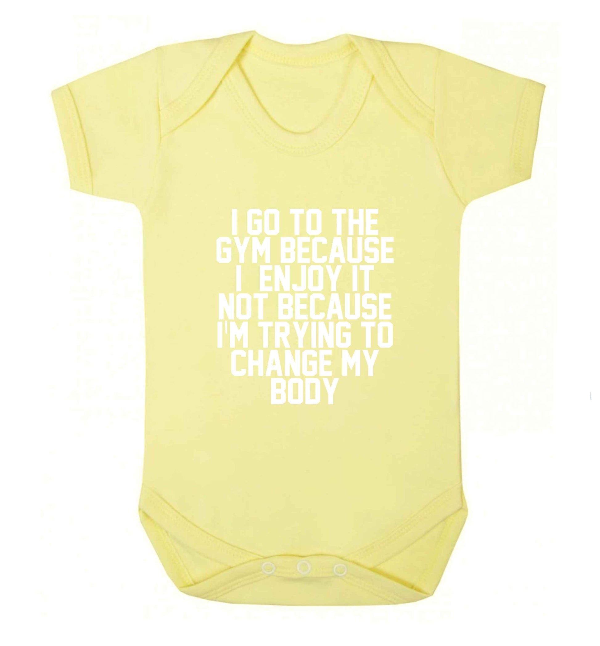 I go to the gym because I enjoy it not because I'm trying to change my body baby vest pale yellow 18-24 months