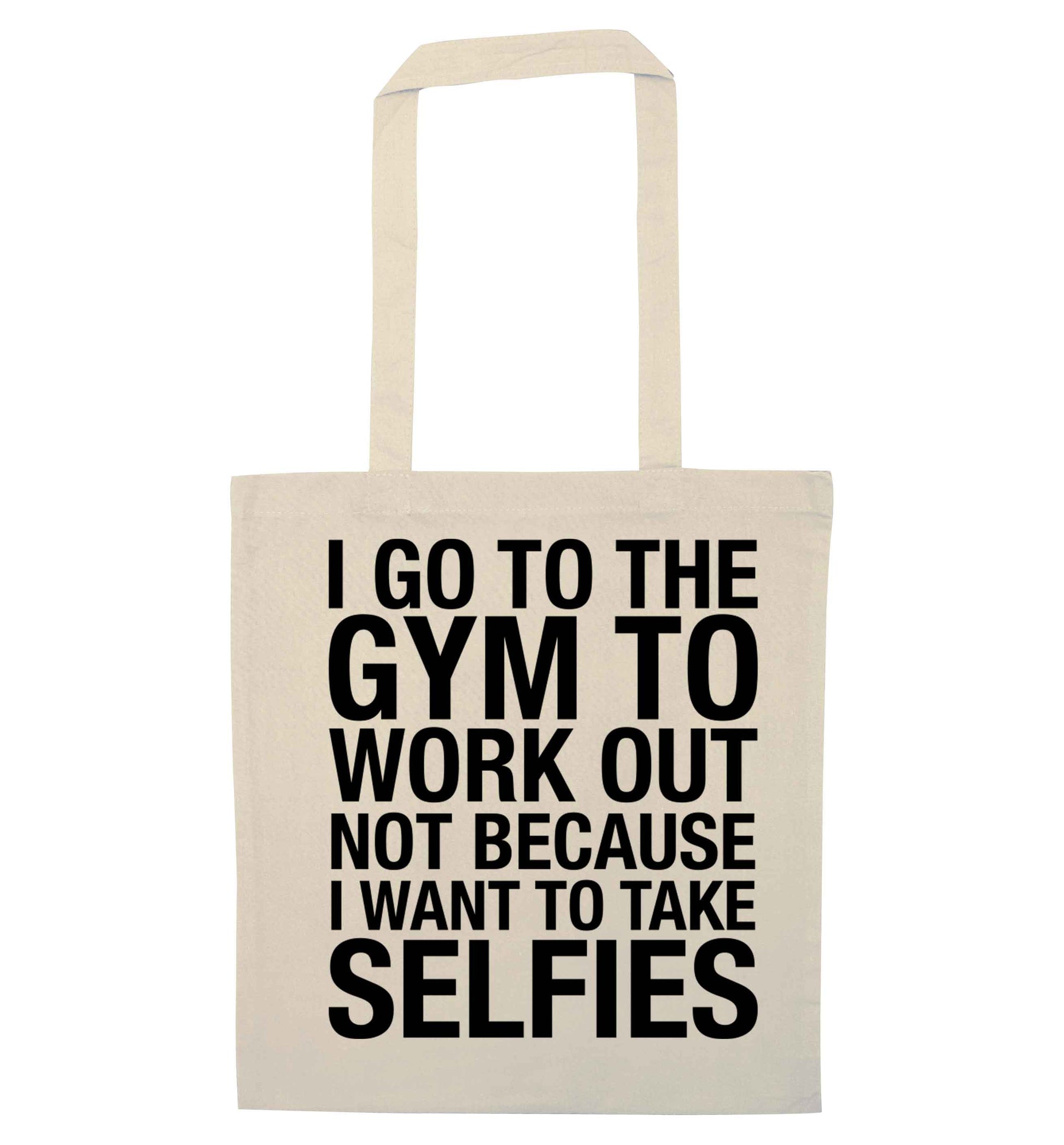 I go to the gym to workout not to take selfies natural tote bag
