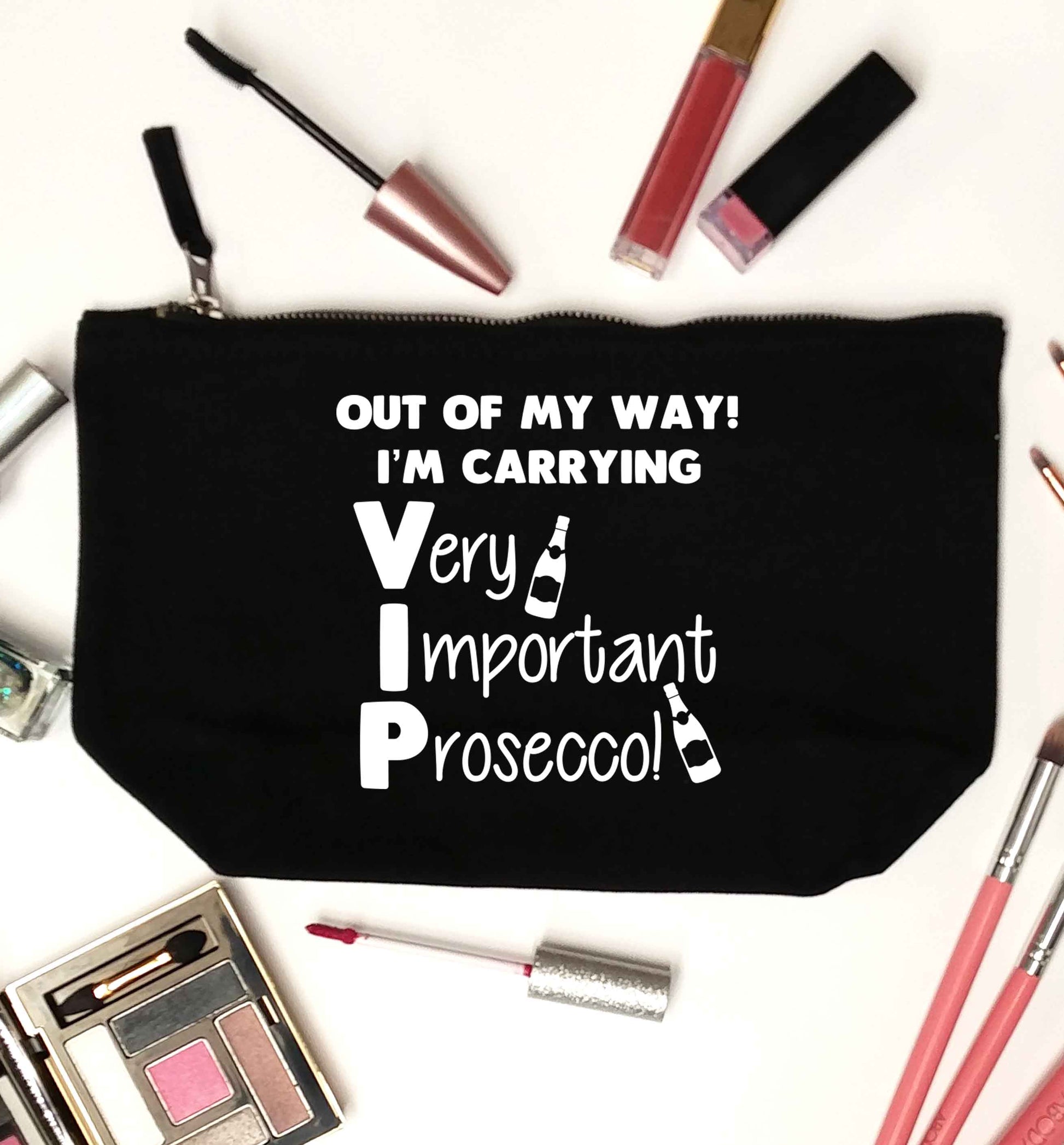 Out of my way I'm carrying very important prosecco! black makeup bag