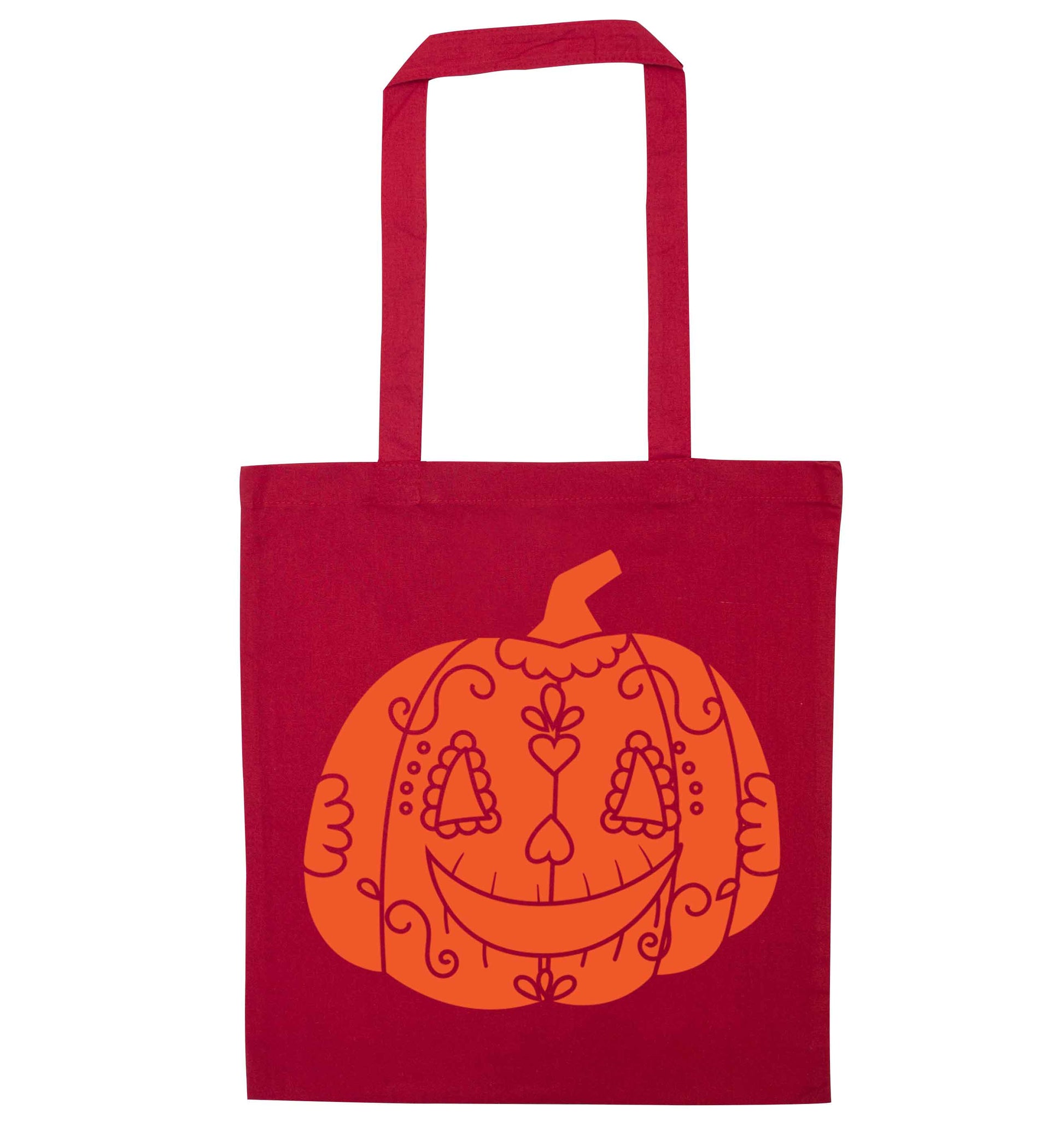 Pumpkin sugar skull red tote bag