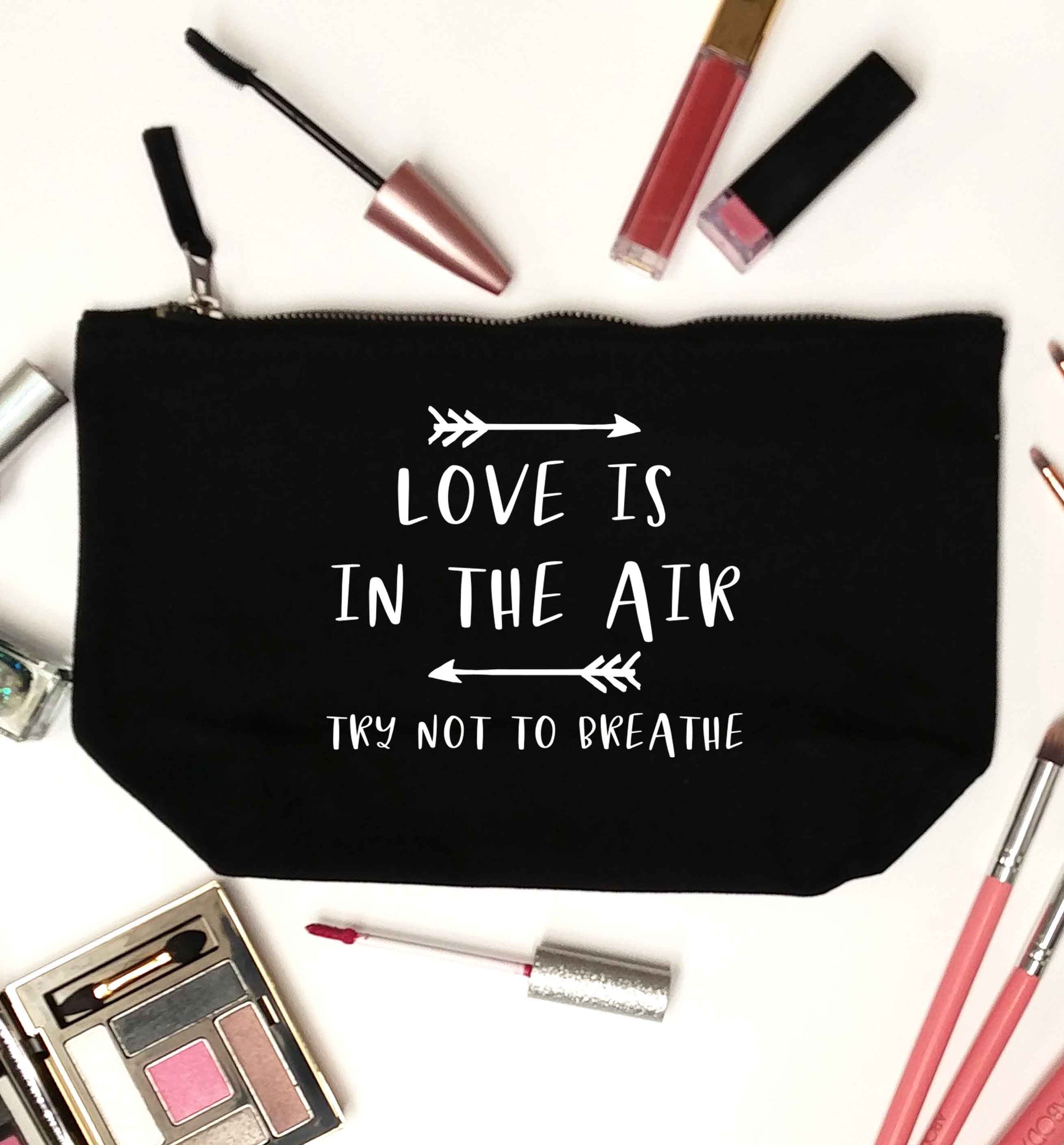 Love is in the air try not to breathe black makeup bag