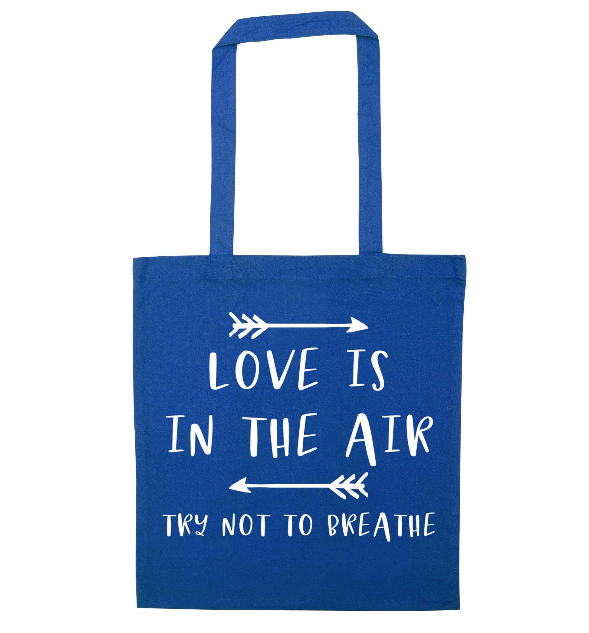Love is in the air try not to breathe blue tote bag