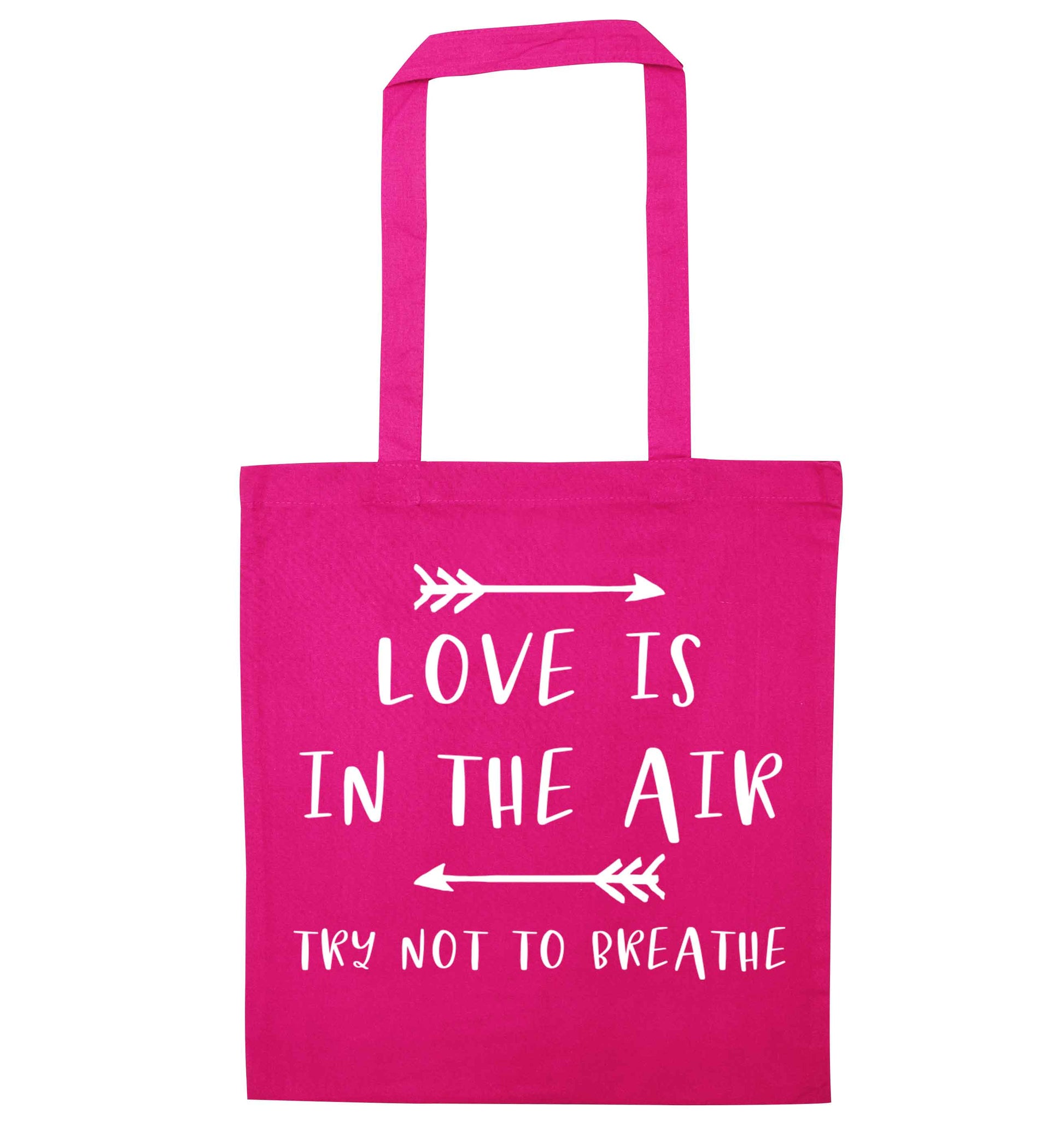 Love is in the air try not to breathe pink tote bag