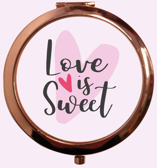 Love really does make the world go round! Ideal for weddings, valentines or just simply to show someone you love them!  rose gold circle pocket mirror