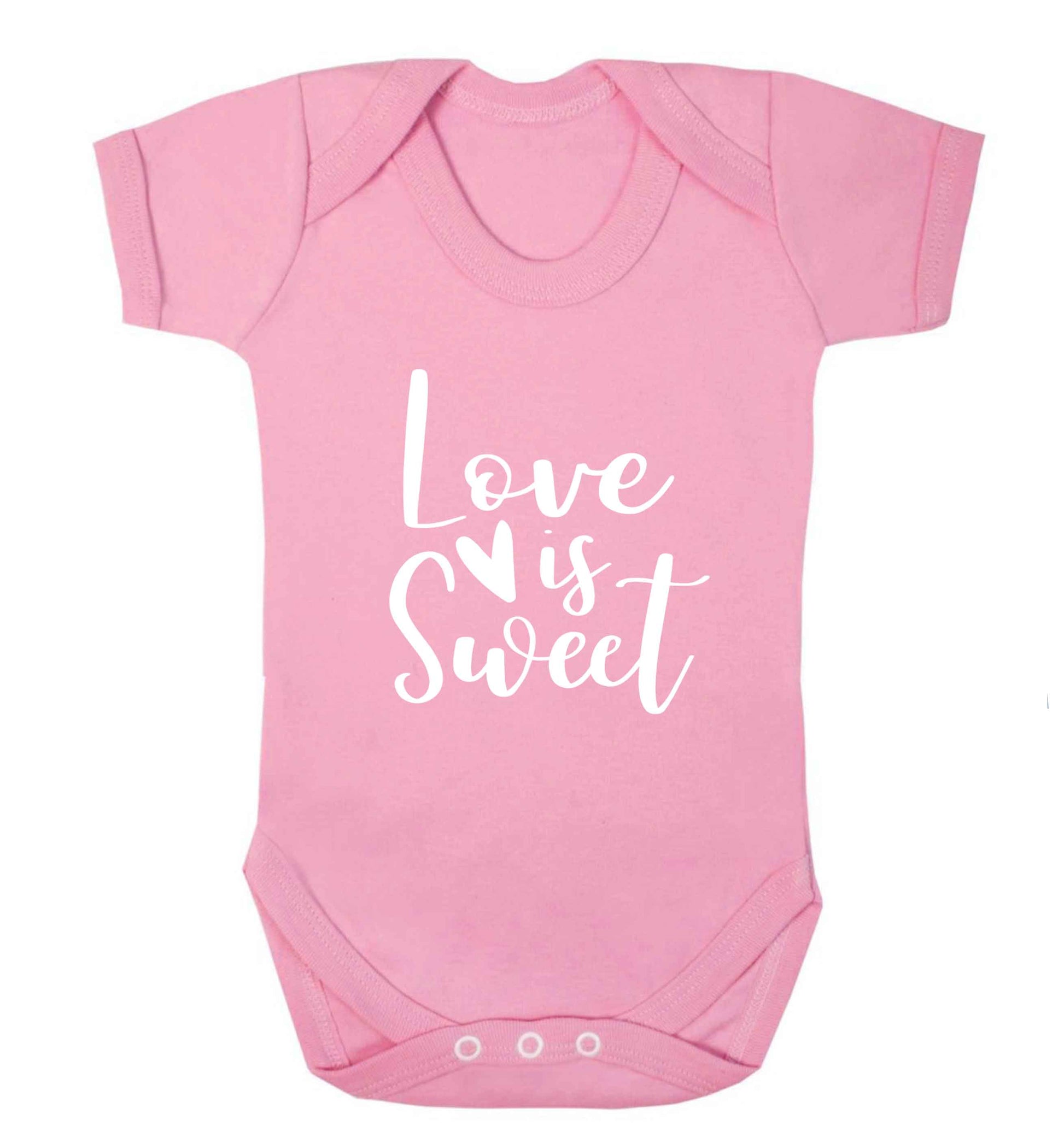 Love really does make the world go round! Ideal for weddings, valentines or just simply to show someone you love them!  baby vest pale pink 18-24 months