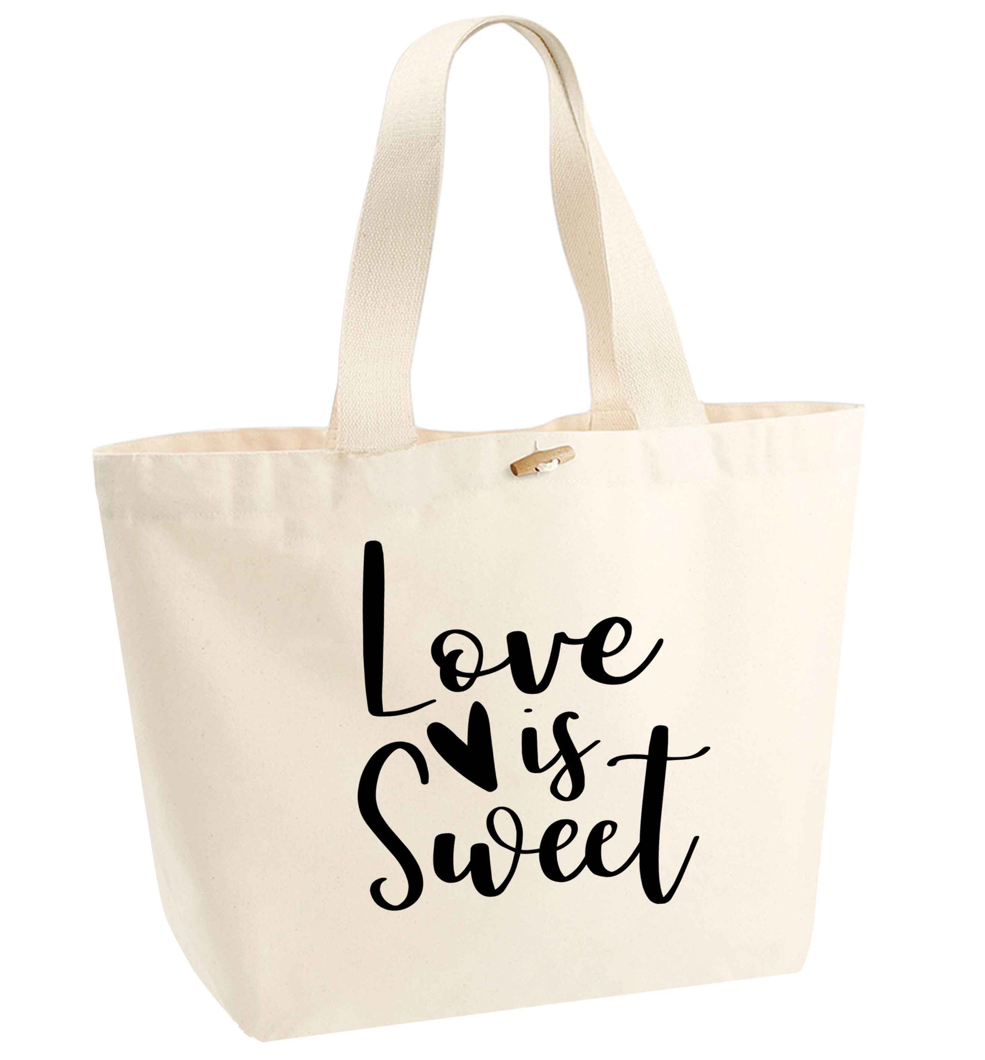 Love really does make the world go round! Ideal for weddings, valentines or just simply to show someone you love them!  organic cotton premium tote bag with wooden toggle in natural