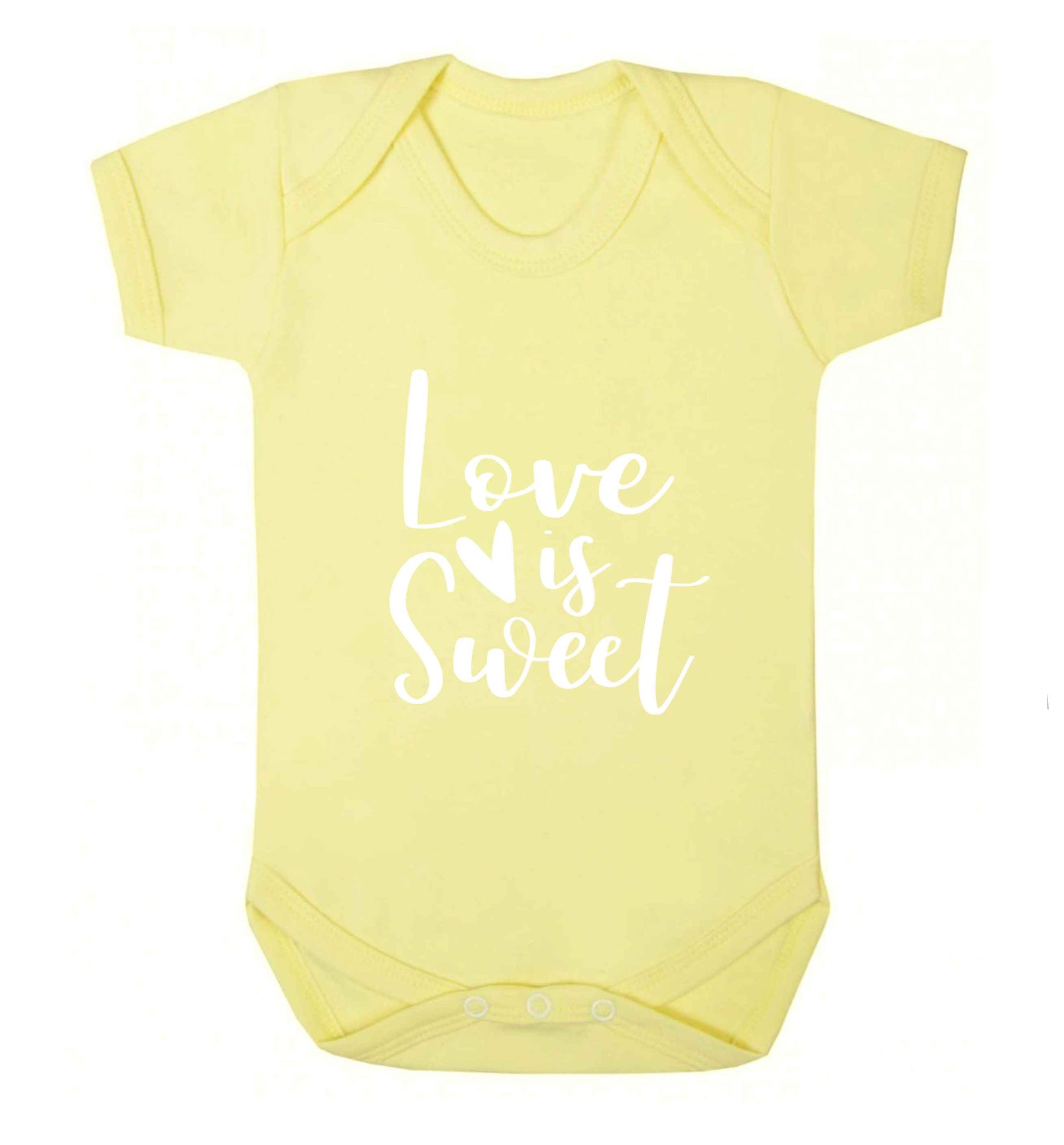 Love really does make the world go round! Ideal for weddings, valentines or just simply to show someone you love them!  baby vest pale yellow 18-24 months