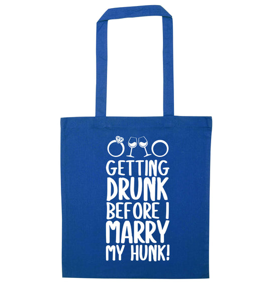 Getting drunk before I marry my hunk blue tote bag