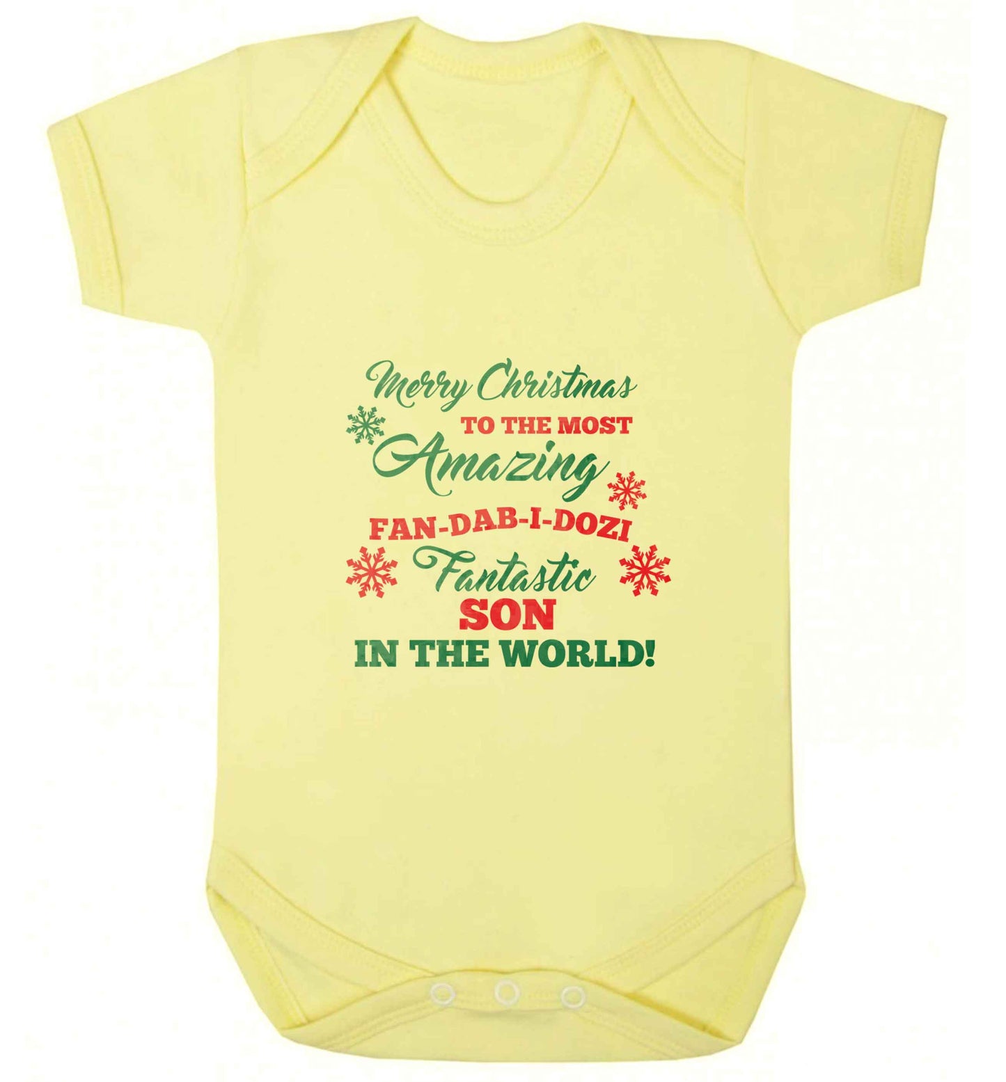Merry Christmas to the most amazing fan-dab-i-dozi fantasic Son in the world baby vest pale yellow 18-24 months